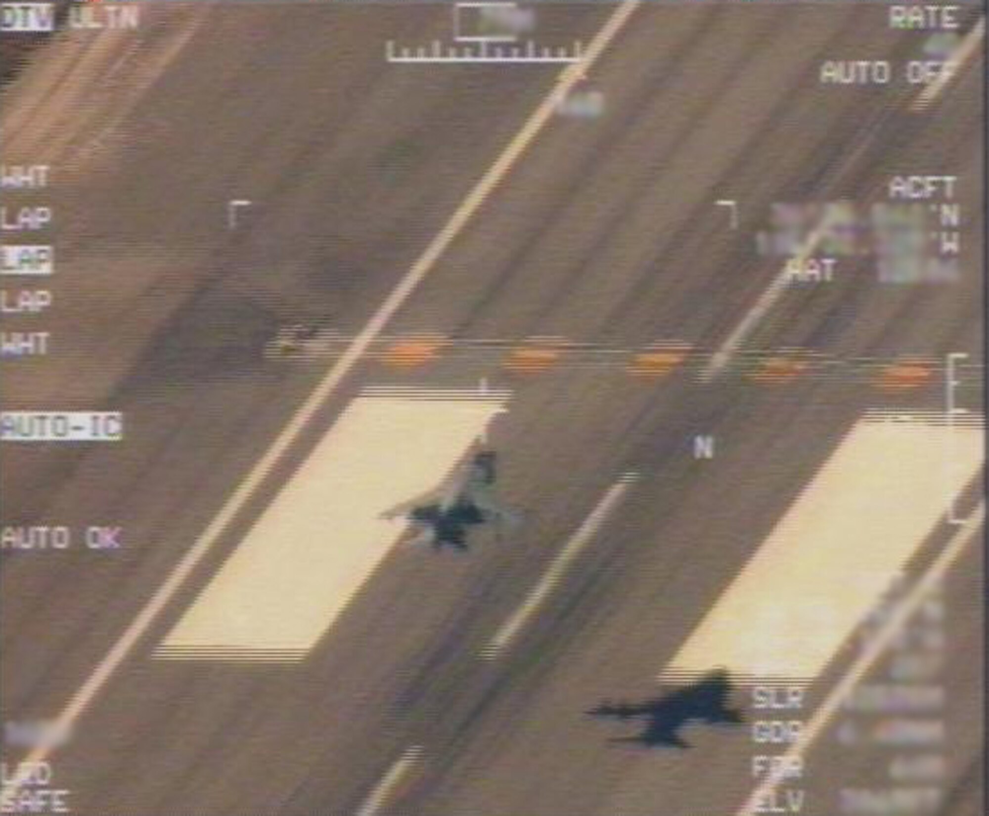 CREECH AFB Nev. – Pictured is footage of a U.S. Marine Corps AV-8B Harrier as it takes off during training here from the runway at Creech AFB. The footage was taken by a MQ-1 Predator assigned to the 11th Reconnaissance Squadron.   The Harrier is assigned to Marine Attack Squadron 513, Marine Corps Air Station Yuma, Ariz. The Marine unit was here conducting a joint training exercise with the 11 RS Oct. 24 through Nov. 7.  (Courtesy photo)  