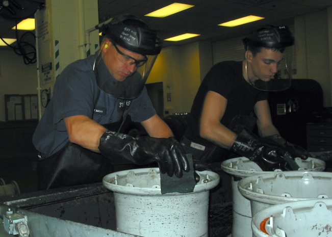 Staff Sgt. Stephen Novak, left, and Airman 1st Class Casey Harrison dry wheels after being washed in the jet washer at the wheel and tire shop on Charleston AFB Nov. 10. The 437th Maintenance Squadron Wheel and Tire Shop completed 462 wheel and tires during October, beating the Air Force record of most tires processed in one month.  Sergeant Novak is an aerospace maintenance craftsman and Airman Harrison is an aerospace maintenance journeyman, both with the 437 MXS. (U.S. Air Force photo/Staff Sgt. Jennifer Arredondo)