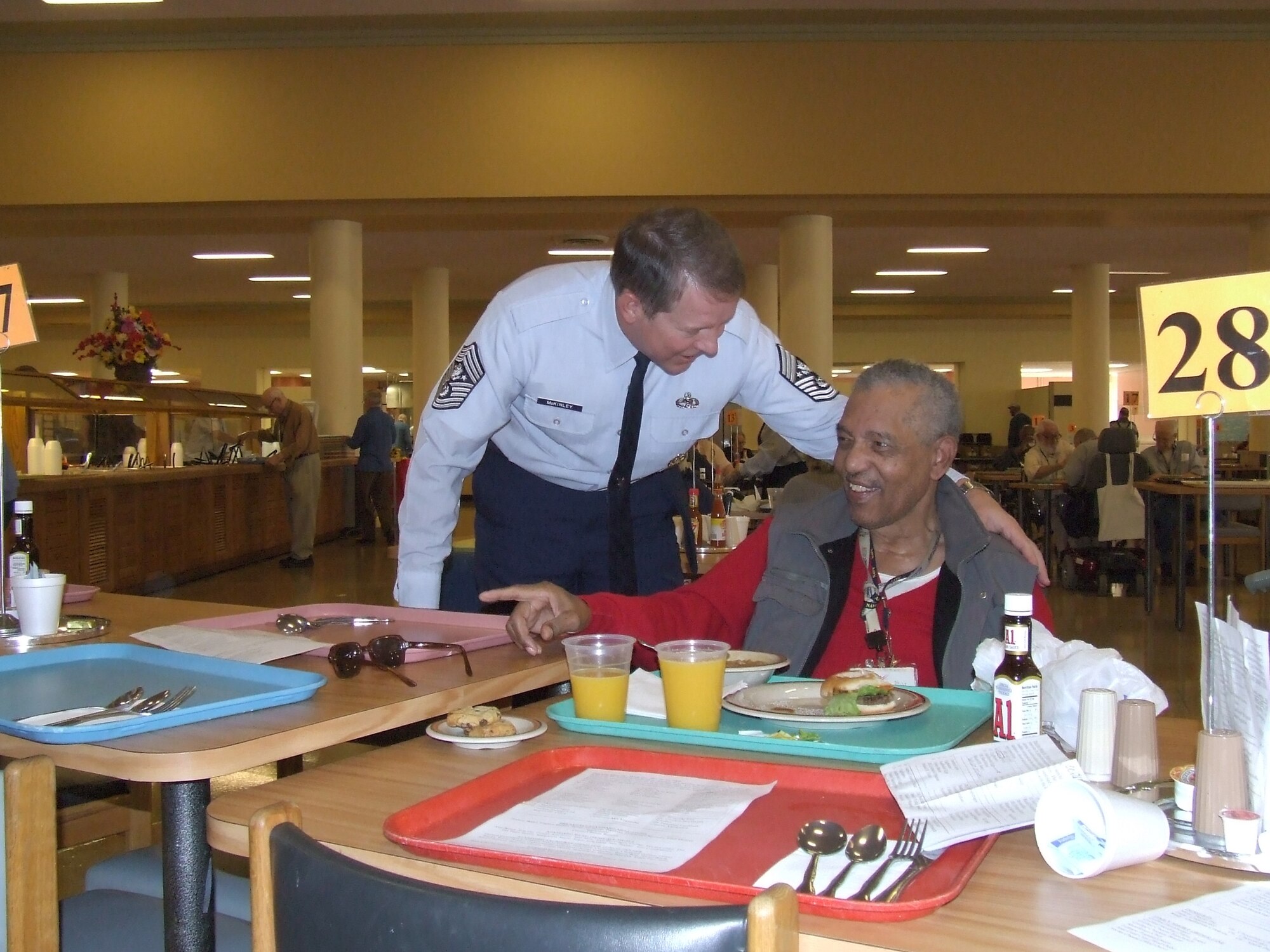 Chief Master Sgt. of the Air Force Rodney J. McKinley shares a laugh with Navy veteran Bill Palmer at the Armed Forces Retirement Home in Washington D.C.  The chief and his entire staff visited the home Nov. 10 to honor the veterans there. (U.S. Air Force photo/Senior Master Sgt. Sean E. Cobb)
