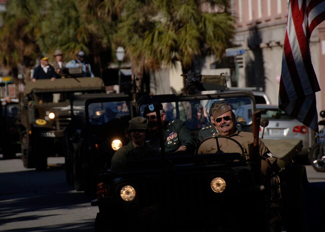 Veterans dressed in uniform drive through downtown Charleston in vintage military vehicles Nov. 9. Retirees, active-uty members and former prisoners of war from all branches of the armed forces joined together to celebrate Veteran's Day. (U.S. Air Force photo/Senior Airman Timothy Taylor)