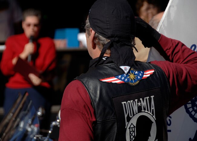 A retired Air Force member salutes the American flag during the singing of the national anthem before the Veterans Day Parade in downtown Charleston Nov. 9. Retirees, active duty members and former prisoners of war from all branches of the armed forces joined together to celebrate Veterans Day. (U.S. Air Force photo/Senior Airman Timothy Taylor)