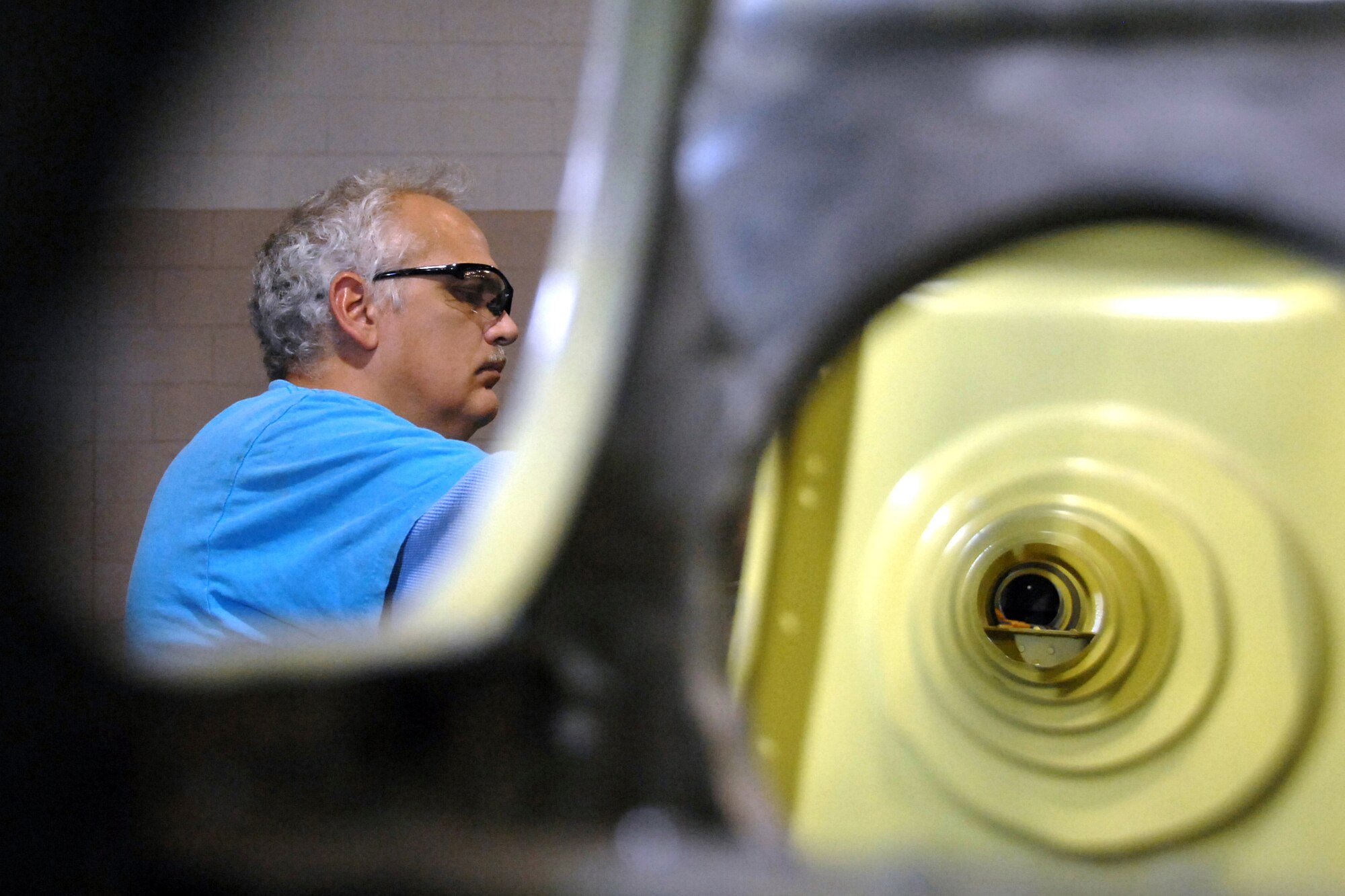 OFFUTT AIR FORCE BASE, Neb. -- Walter Chapman, an aircraft sheet metal technician with the 55th Maintenance Squadron, works on the access panel of a B17 Horizontal stabilizer Nov. 5. All the corroded metal was replaced and primed as part of a lengthy frame-off restoration on this historic air frame located near the SAC gate here. 

U.S. Air Force Photo by Josh Plueger
