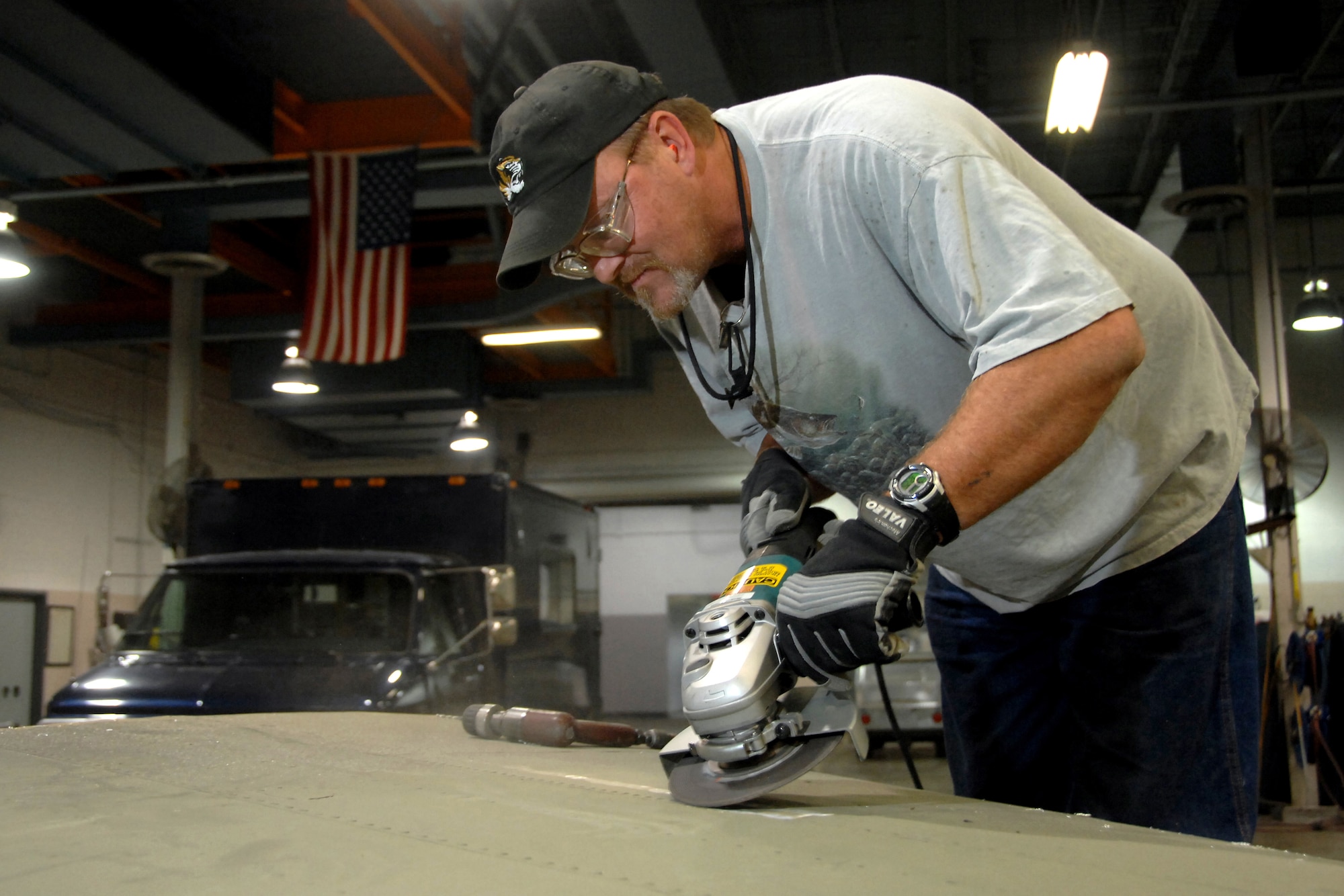 OFFUTT AIR FORCE BASE, Neb. -- Warren Darr, an aircraft structural maintainer and squadron information manager assigned to the 55th Maintenance Squadron, grinds down rivets on the horizontal stabilizer of a B17 static display aircraft in order to remove corroded sheet metal to ensure structural integrity of the historic air frame as part of a lengthy frame-off restoration.

U.S. Air Force Photo by Josh Plueger
