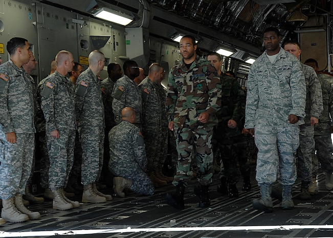Members of the Charleston AFB Honor Guard exit a C-17 during a ceremony that was part of chaplain training here Nov. 6. More than 100 Army chaplains from the U.S. Army Chaplain Center and School in Fort Jackson, S.C., attended the training to learn about ramp and flightline ceremonies. (U.S. Air Force photo/Airman 1st Class Katie Gieratz)