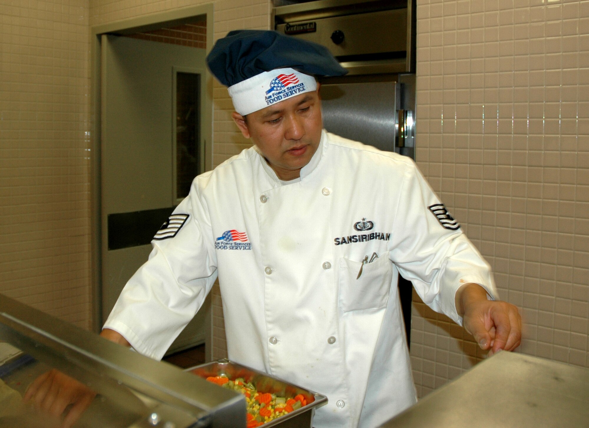Tech. Sgt. Paul Sansiriban, a Reservist with the 446th Services Flight, prepares lunch for the November Reserve weekend. Sergeant Sansiriban is one of more than 2,400 Citizen Airmen serving in the 446th Airlift Wing at McChord Air Force Base, Wash. (U.S. Air Force photo/Tech. Sgt. Jake Chappelle) 