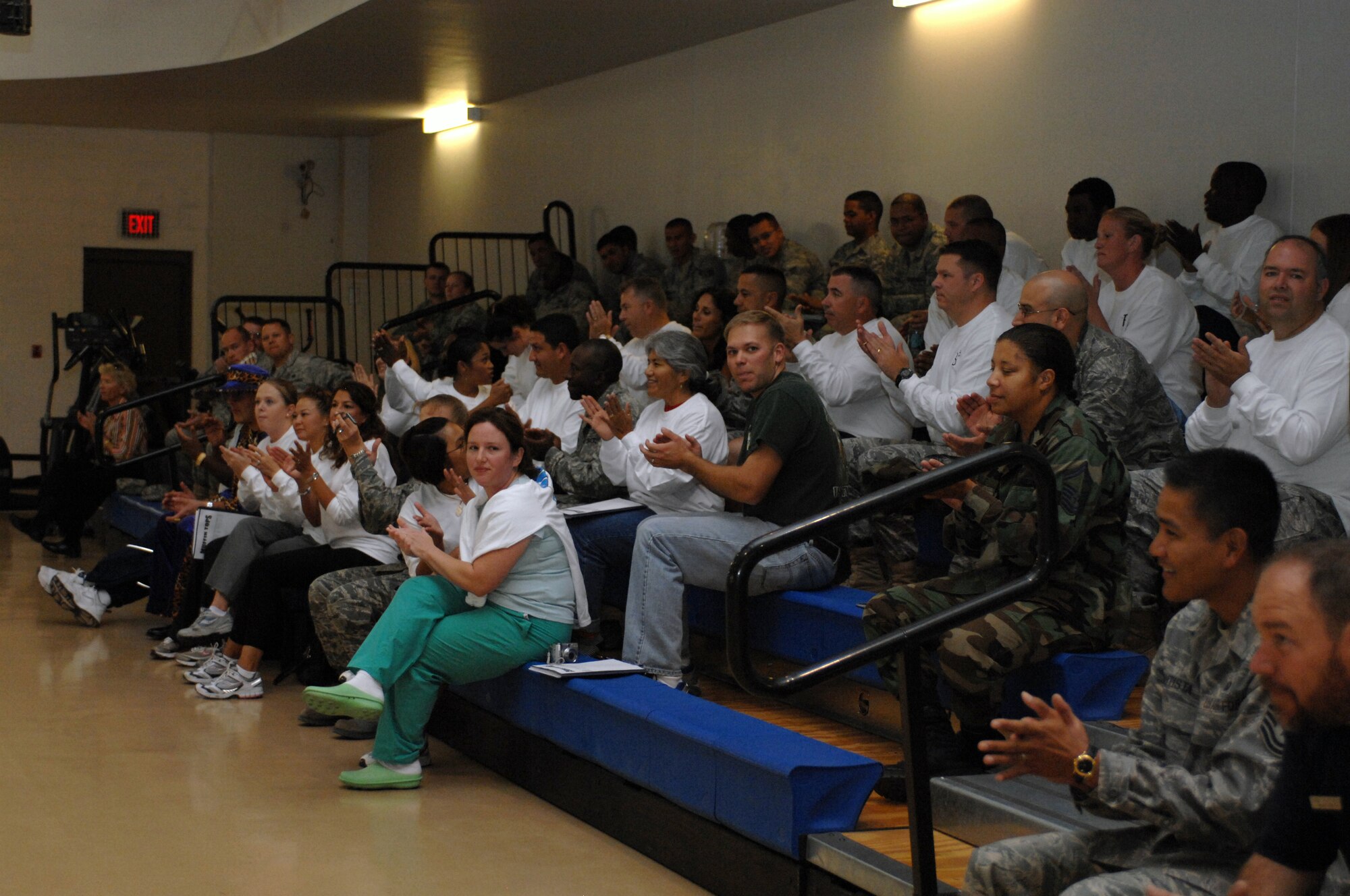 Members of Team Holloman who participated in the Biggest Loser competition applaud themselves for a job well done during the awards ceremony at the Fitness and Sports Center at Holloman Air Force Base, N.M., Oct. 31. A total of 17 teams participated in the competition and the total weight lost was 1,078 pounds. The individual who lost the most weight was Tech Sgt. Jennifer Pahl, 49th Medical Operations Squadron, member of team En Fuego, with a weight loss of 24.5 pounds. (U.S. Air Force photo/Airman Sondra M. Escutia)