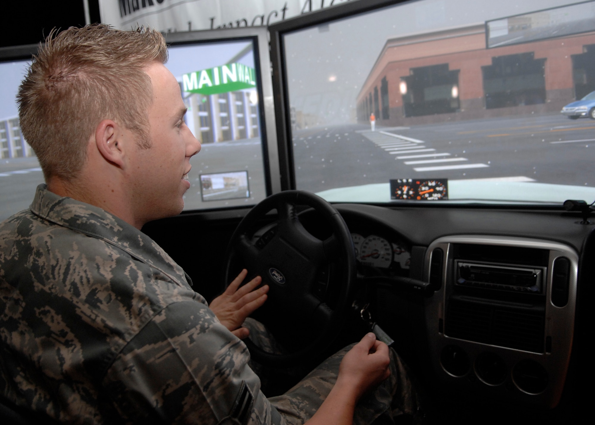 Airman 1st Class Kyle Moline drives a drunk driving simulator during the Save A Life Tour at the base theater Nov. 7. The Save A Life Tour also included a 12-minute video with graphic scenes to show the reality and severity of drunk driving consequences. Airman Moline is with the 437th Logistics Readiness Squadron. (U.S. Air Force photo/Airman 1st Class Katie Gieratz) 