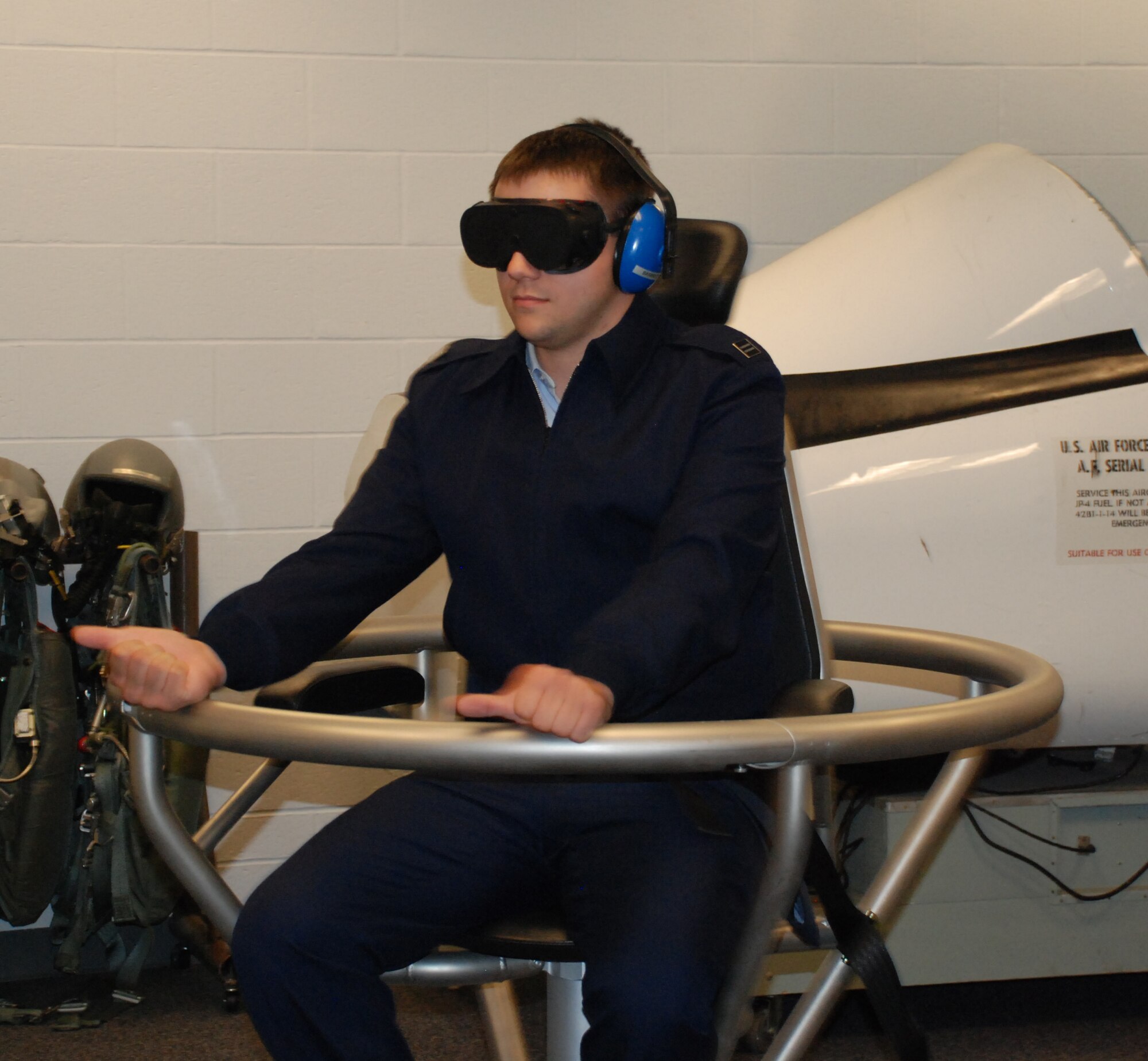 Cadet Capt. Justin Allston, a University of North Texas ROTC cadet, experiences what it's like to for pilots to fly in aircraft at night during a spatial disorientation exercise on the barany chair Nov. 7 at Aerospace Physiology. Twenty-seven cadets toured Sheppard's facilities including the Heritage Center, T-38 simulaters, the F-22 maintenance training facility and the 82nd Security Forces Squadron Canine Arena. (U.S. Air Force photo/Airman 1st Class Candy Miller) 