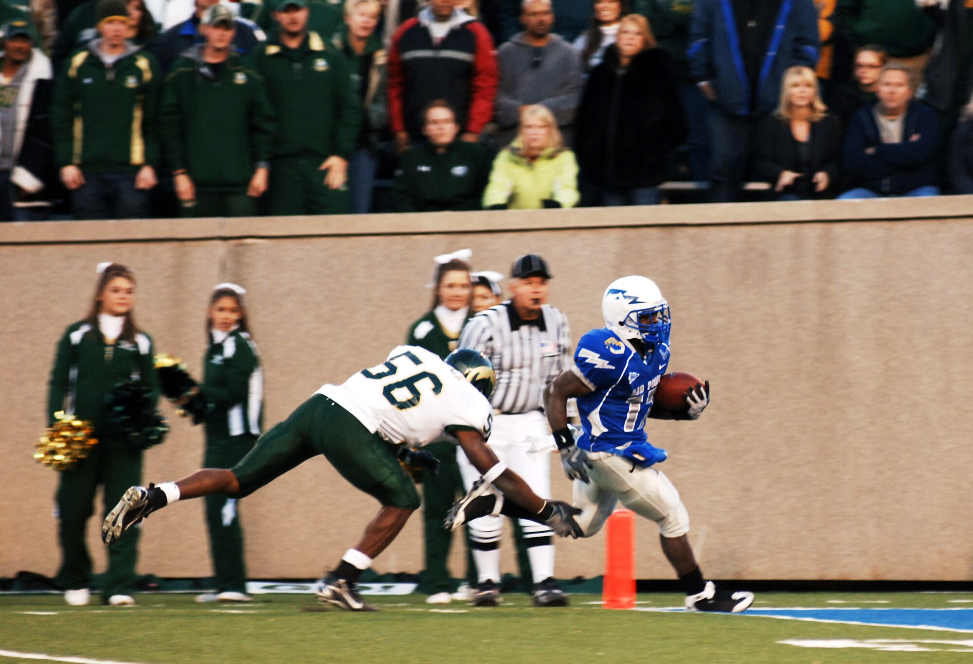 Air Force Falcon freshman Asher Clark rushes for his first of two touchdowns against Colorado State University Nov.8 at Falcon Stadium in Colorado. The Falcons went on to beat the Rams 38-17, advancing their record 8-2, which is its best 10-game record since 1998 when the team opened 9-1. (U.S. Air Force photo/Tech. Sgt. Christopher DeWitt)