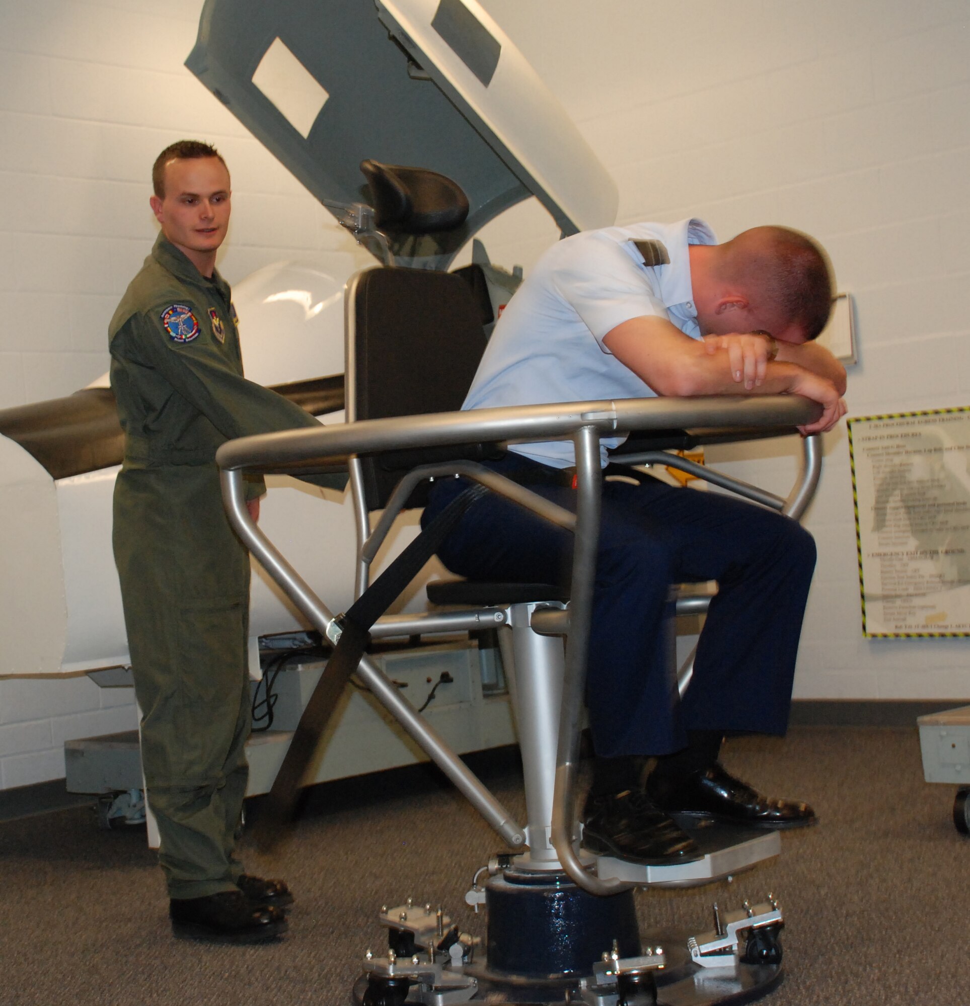 Cadet 3rd Class Shane Densmore, a University of North Texas ROTC cadet, experiences what it's like to for pilots to fly in aircraft during a spatial disorientation exercise on the barany chair Nov. 7 at Aerospace Physiology. Twenty-seven cadets toured Sheppard's facilities including the Heritage Center, T-38 simulaters, the F-22 maintenance training facility and the 82nd Security Forces Squadron Canine Arena. (U.S. Air Force photo/Airman 1st Class Candy Miller) 