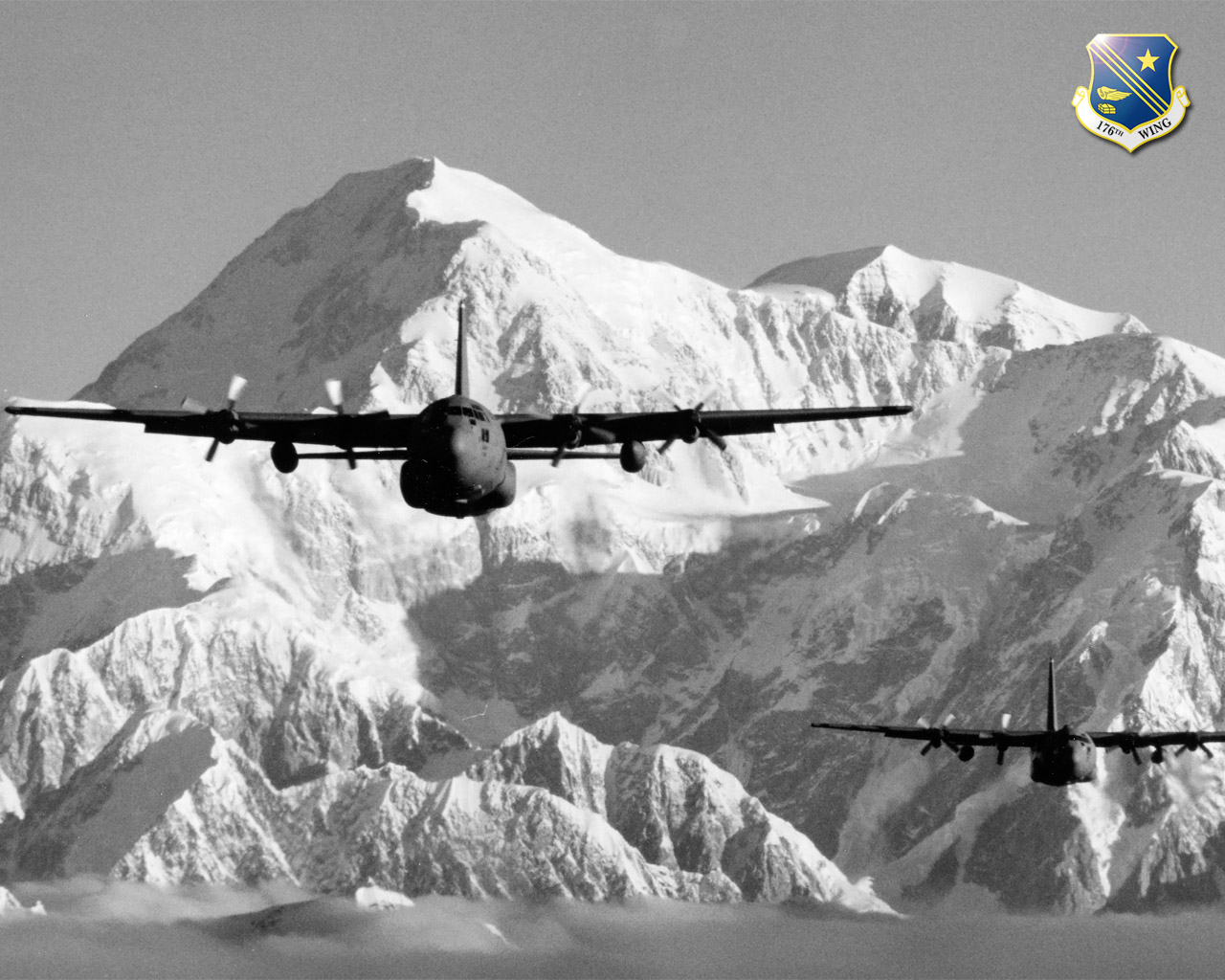 C-130s from the Alaska Air National Guard's 176th Wing fly near Mt. McKinley.