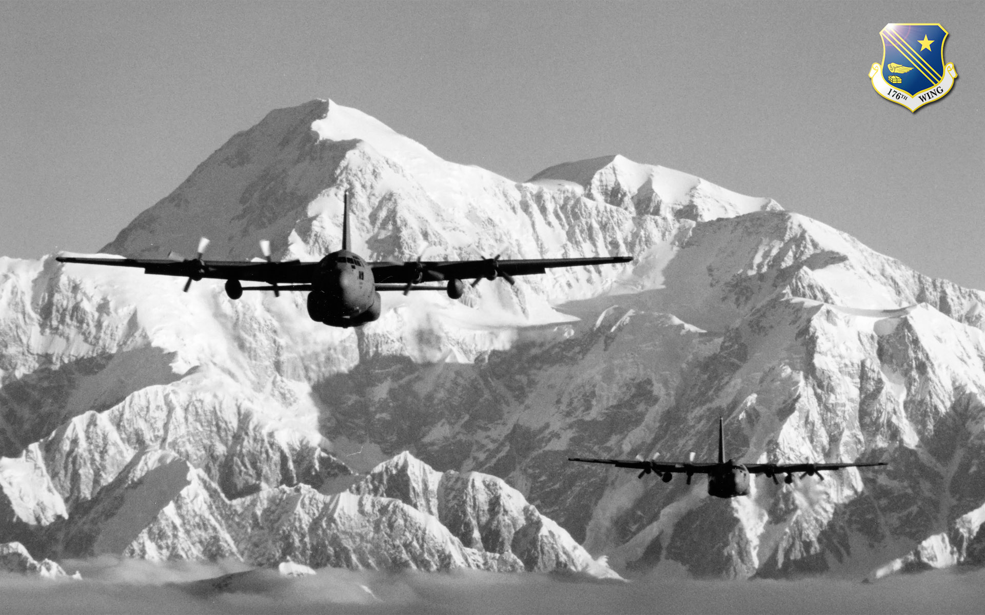 C-130s from the Alaska Air National Guard's 176th Wing fly near Mt. McKinley.