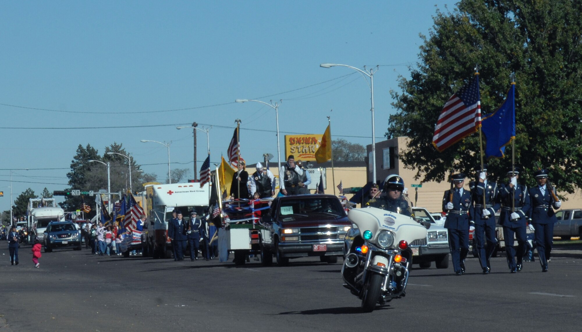 CANNON AIR FORCE BASE N.M. -- Local authorities and the 27th Special Operations Wing Honor Guard leads the Clovis Veterans Day parade down Main Street Nov. 8. The local community honored our veterans during the annual parade. (U.S. Air Force photo by Airman 1st Class James R. Bell)