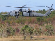 MOODY AIR FORCE BASE, Ga.—Two pararescuemen from the 38th Rescue Squadron repel from an HH-60G Pave Hawk helicopter during a combat search and rescue demonstration here Nov. 7.  The exercise demonstrated the capabilities of the current Flying Tigers. (U.S. Air Force photo by Staff Sgt. Robin Stanchak)