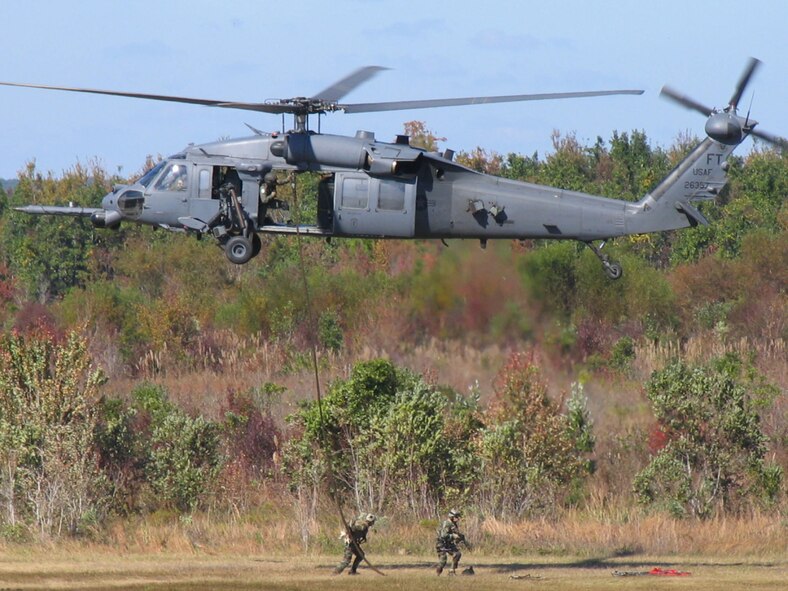 MOODY AIR FORCE BASE, Ga.—Two pararescuemen from the 38th Rescue Squadron repel from an HH-60G Pave Hawk helicopter during a combat search and rescue demonstration here Nov. 7.  The exercise demonstrated the capabilities of the current Flying Tigers. (U.S. Air Force photo by Staff Sgt. Robin Stanchak)