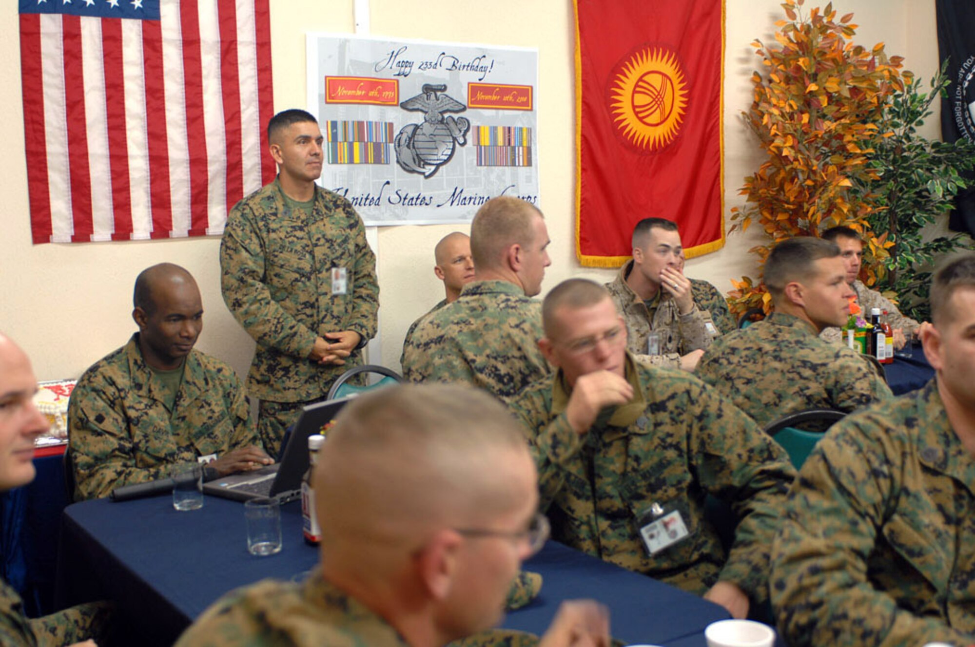 Marines enjoy food and cake at the Ala Too Dining Facility during a celebration of the Marine Corps' 233rd birthday at Manas Air Base, Kyrgyzstan, Nov. 10. The group of 30 Marines deployed from the 3rd Marine Division, Okinawa, are en route to support Operation Enduring Freedom. (U.S. Air Force photo/Tech. Sgt. Michael Voss)
