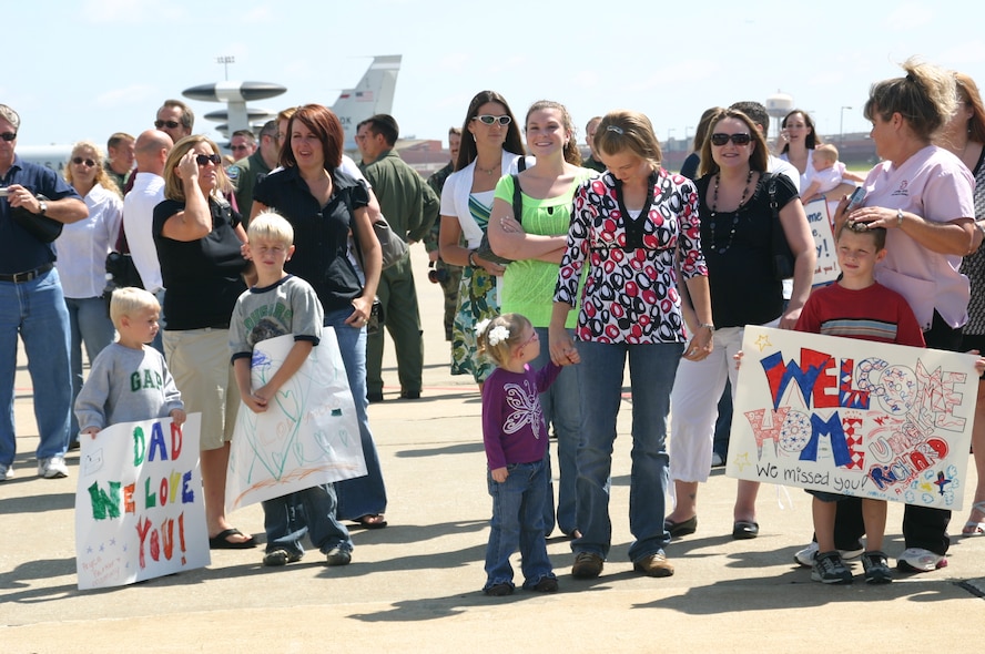Family and friends of the deployed members of the 960th Expeditionary Airborne Air Control Squadron wait anxiously for their loved ones to arrive back in Oklahoma after their rotation in Southwest Asia, supporting the Global War on Terror. Photo courtesy of 1st Lt. Kinder Blacke.