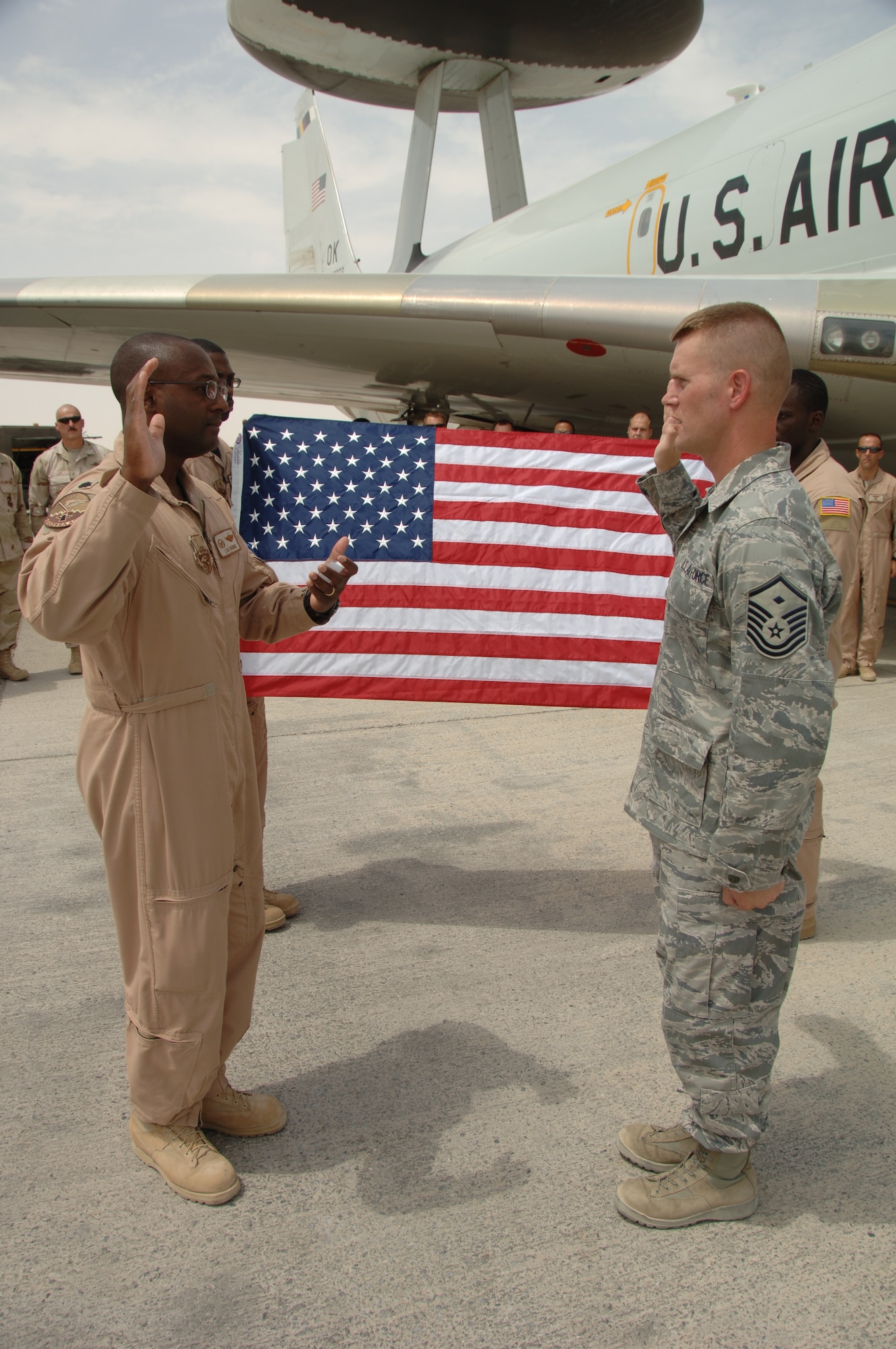 Master Sgt. Michael Mujwid, first sergeant, 960th EAACS, re-enlisted during the squadron’s deployment. He was given the Oath of Office by Lt. Col. Lawrence Brundidge, commander, 960th EAACS, and then congratulated by his fellow Airmen. Photo courtesy of 380 AEW/PA. 