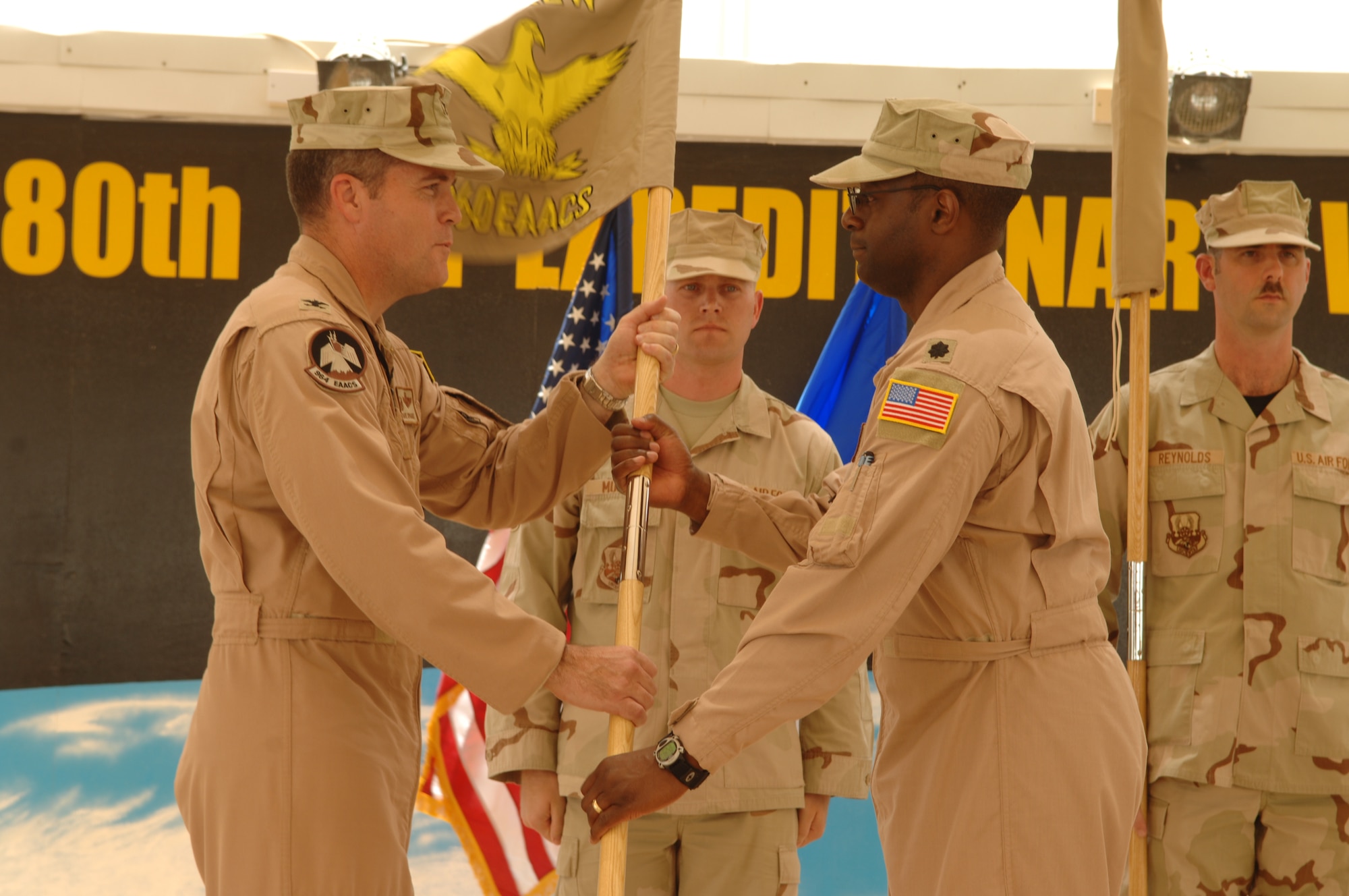 Lt. Col. Lawrence Brundidge accepts command of the newly activated 960th Expeditionary Airborne Air Control Squadron from Col. Dave Sprague, commander, 380th Expeditionary Operations Group. Photo courtesy of 380 AEW/PA.