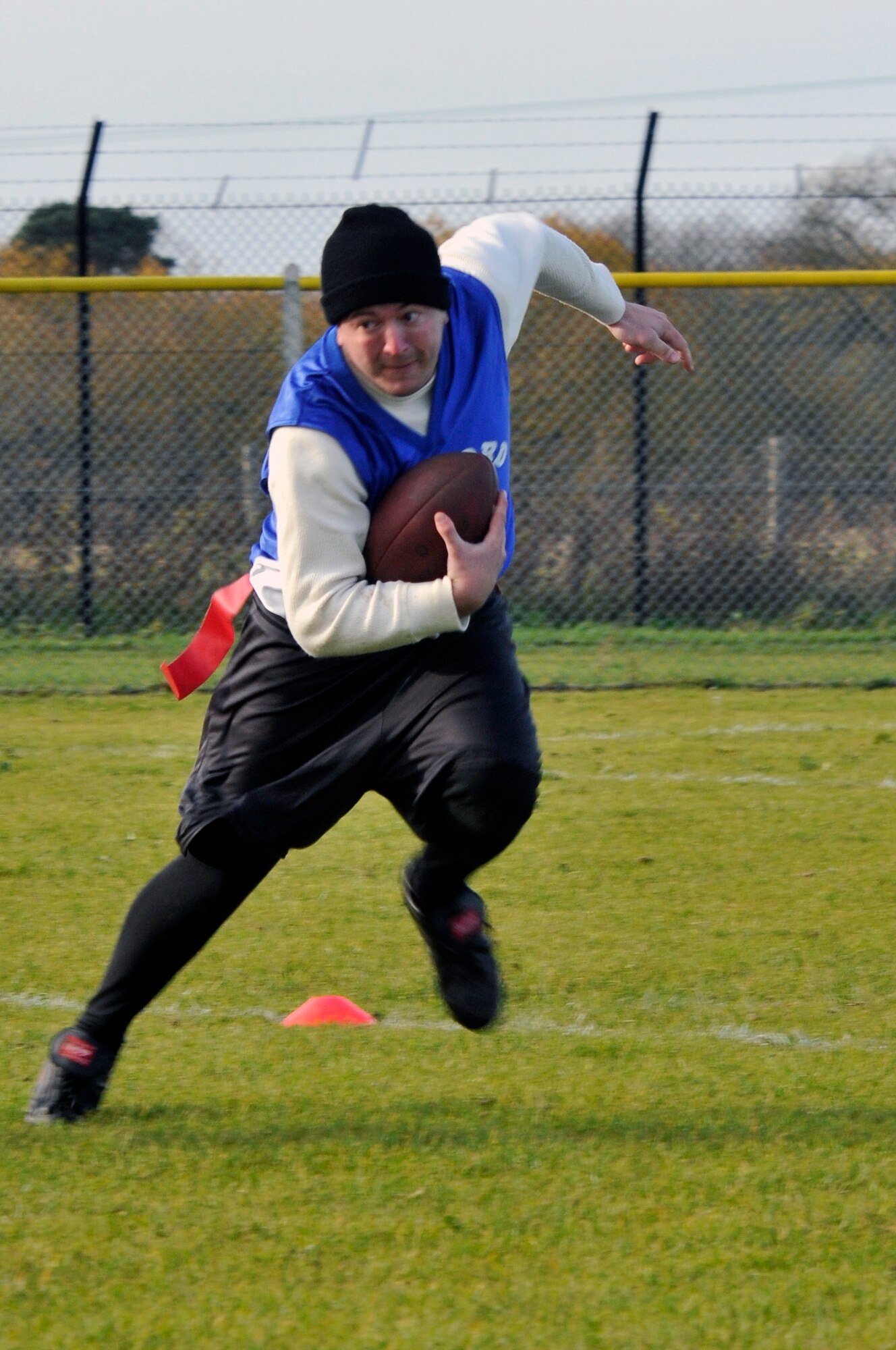 A Fairford Falcon running back powers down the field against the 48th Medical Group's Med Dawg team, Nov. 9 at RAF Lakenheath, England. The Med Dawgs defeated the Fairford Falcons  making them the UK Regional Flag Football champions. (U.S. Air Force photo by Airman 1st Class Perry Aston)