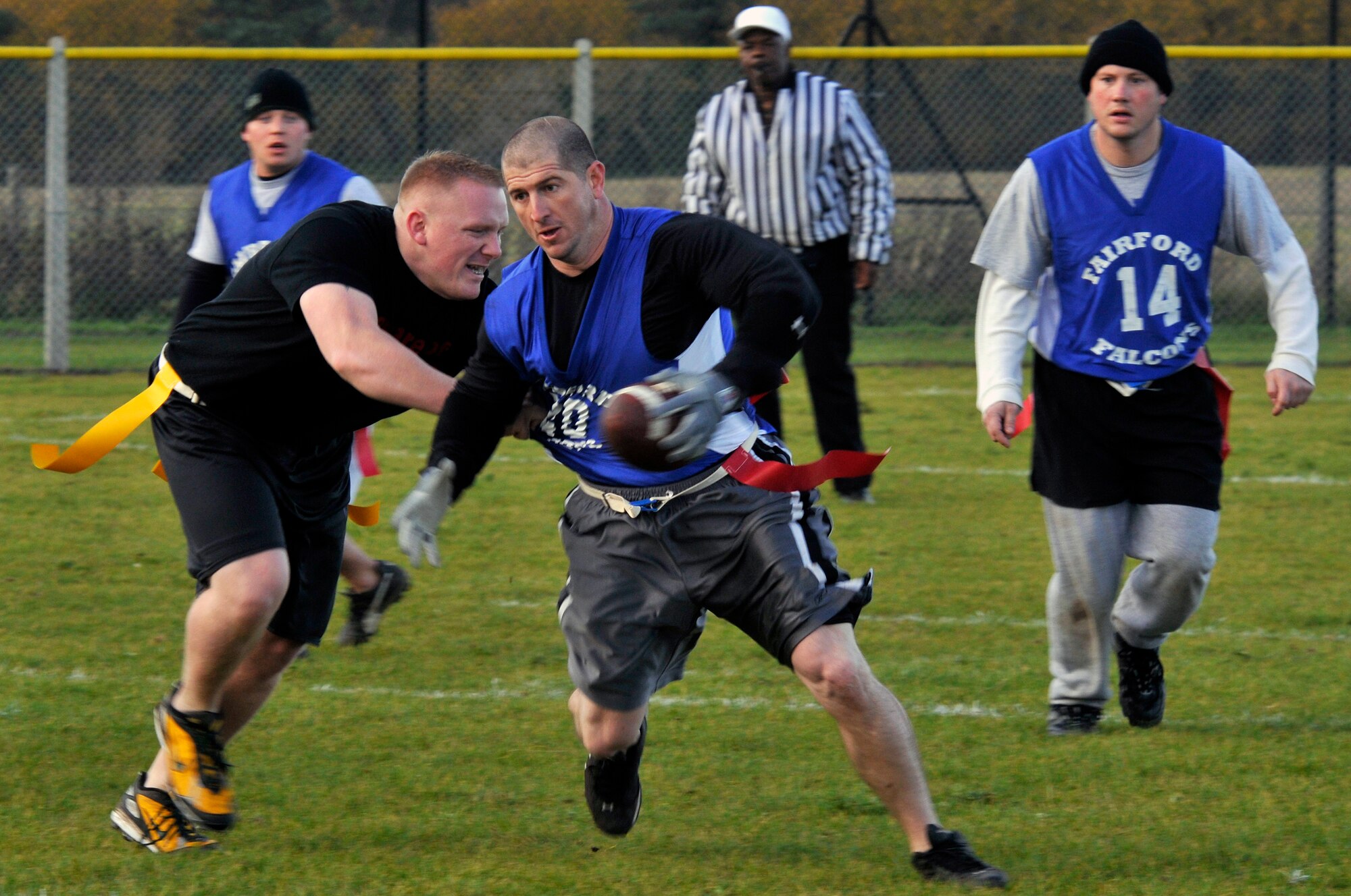 Mehalic Blair, 48th Medical Group's Med Dawgs football team linebacker and wide receiver, snatches the flag off a Fairford falcon, Nov. 9 at RAF Lakenheath, England. The Med Dawgs defeated the falcons making them the UK Regional Flag Football champions. (U.S. Air Force photo by Airman 1st Class Perry Aston)