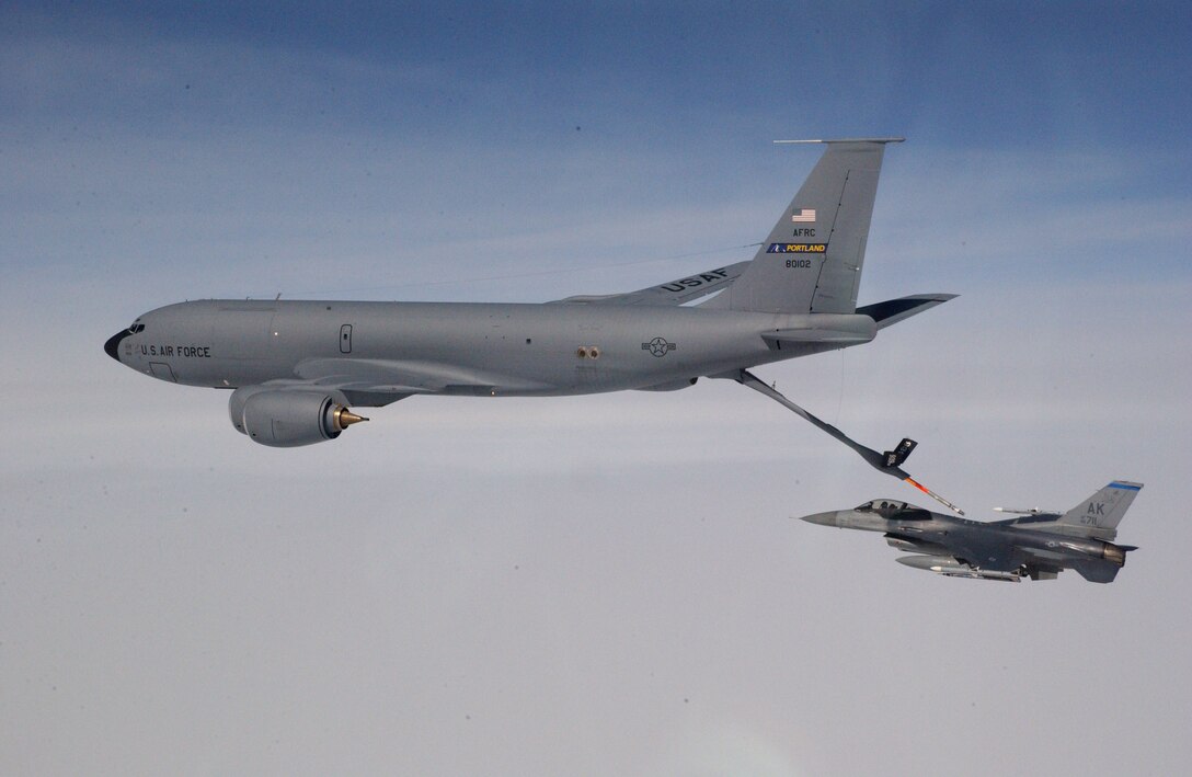 A KC-135 Stratotanker refuels an F-16 Fighting Falcon.   For Nov. 8, coalition tankers flew 47 sorties and off-loaded approximately 3.1 million pounds of fuel to 247 receiving aircraft.  (U.S. Air Force photo by Master Sgt. Rob Wieland)