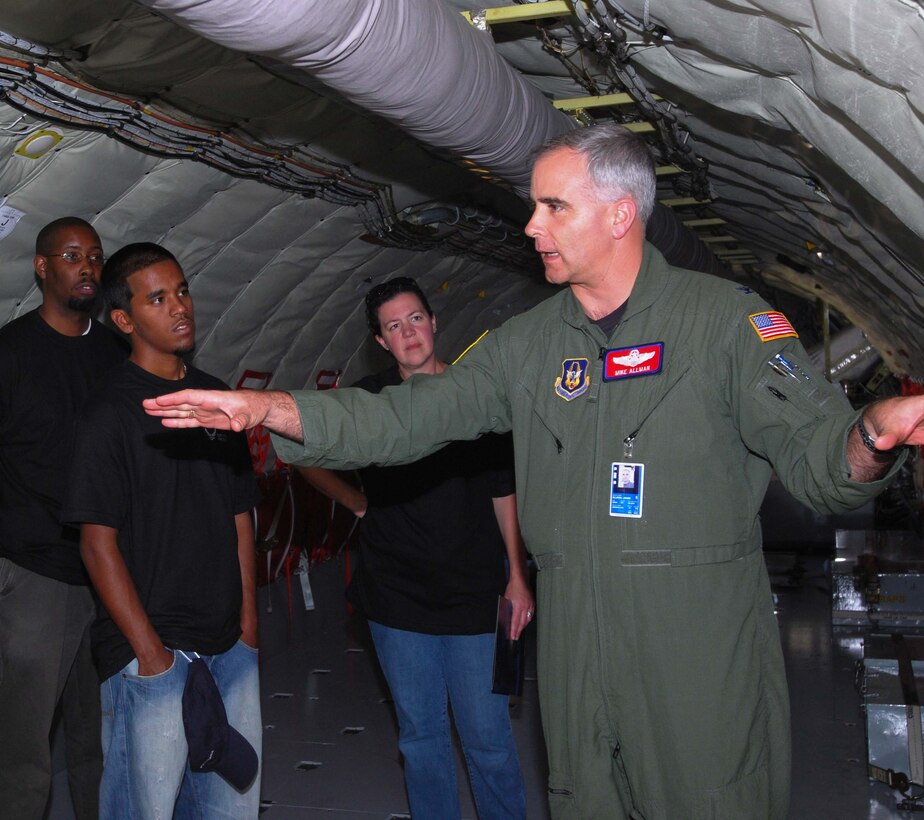 ANDREWS AIR FORCE BASE, M.D. -- (Right) Col. Mike Allman, 459th Air Refueling Wing vice commander, conducts a tour of the KC-145 at the Andrews Air Force Base Reserve recruiting mass enlistment ceremony October 14.   Ten individuals, including prior enlisted and first term Airman raised their right hand to take the oath of enlistment administered by the 459th ARW commander, Col Tim Cahoon aboard a KC-135.  (U.S. Air Force photo/Senior Airman Sasha S. Skrine)  