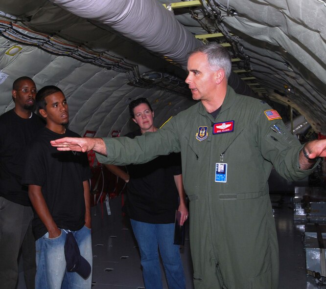ANDREWS AIR FORCE BASE, Md. -- (Right) Col. Mike Allman, 459th Air Refueling Wing vice commander, conducts a tour of the KC-135 at the Andrews Air Force Base Reserve recruiting mass enlistment ceremony October 14. Ten individuals, a combination of prior enlisted and first term Airman, raised their right hand to take the oath of enlistment administered by the 459th ARW commander, Colonel Tim Cahoon. (U.S. Air Force photo/Senior Airman Sasha S. Skrine) 
