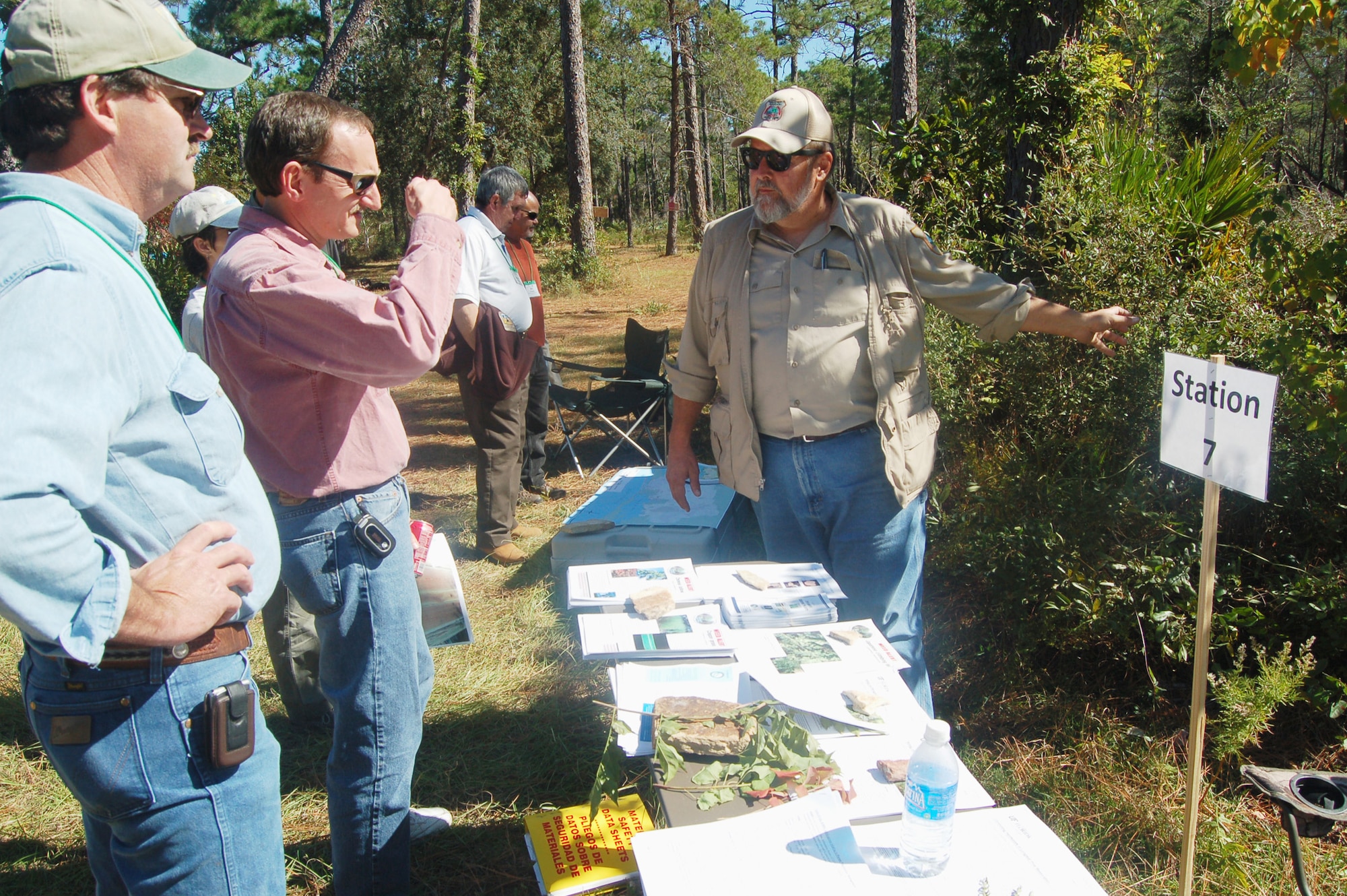 EGLIN AIR FORCE BASE, Fla. -- Dennis Teague, Eglin endangered species biologist, explains how Eglin natural resource managers remove invasive plant species from the reservation to members of the Longleaf Alliance group Oct. 30. The Alliance held their regional conference in Sandestin and toured the Eglin reservation to learn how Eglin natural resource managers maintain the installation's longleaf ecosystem./U.S. Air Force photo by Jerron Barnett