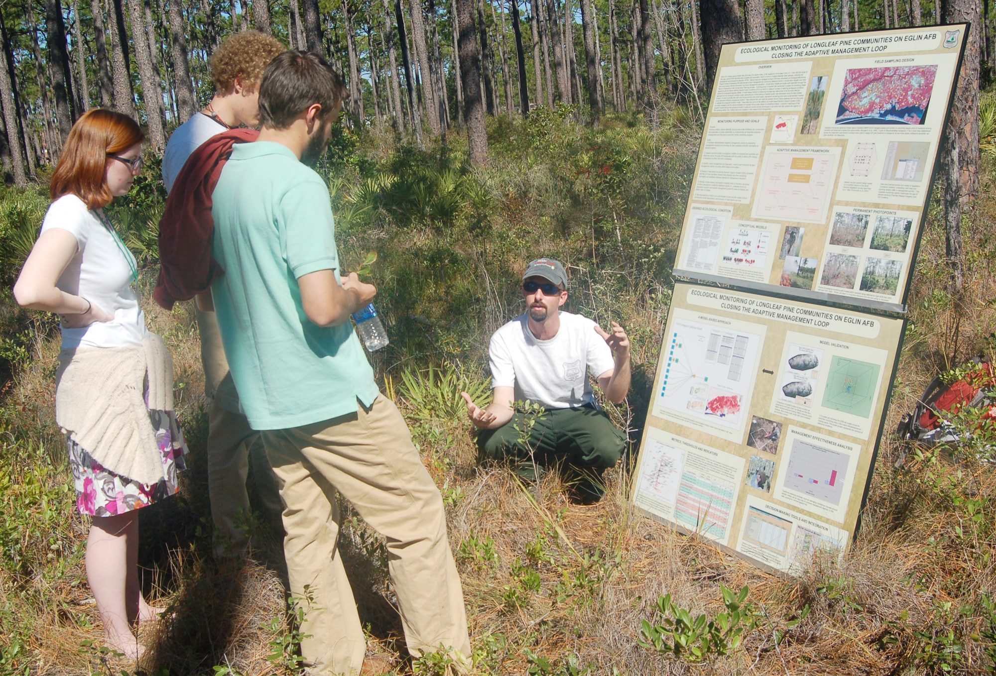 EGLIN AIR FORCE BASE, Fla. -- Brett Williams, Eglin fire ecologist, explains how Eglin natural resource managers conduct ecological monitoring activities on the reservation to members of the Longleaf Alliance group Oct. 30. The Alliance held their regional conference in Sandestin and toured the Eglin reservation to learn how Eglin natural resource managers maintain the installation's longleaf ecosystem./U.S. Air Force photo by Jerron Barnett