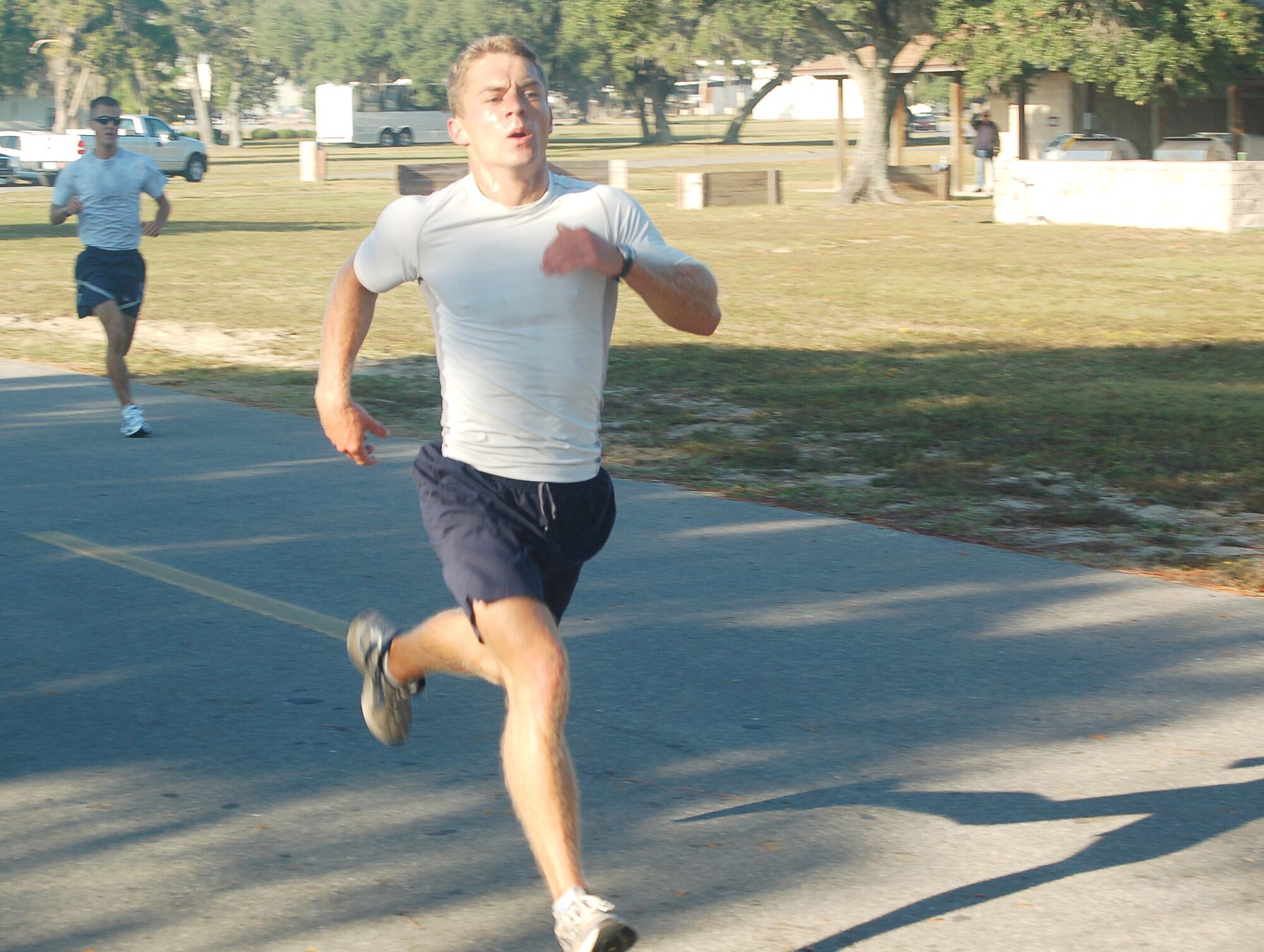 EGLIN AIR FORCE BASE, Fla. -- 2nd Lt. Joe Czabaranek, Air Force Research Lab engineer, sprints for the finish line during Eglin?s first America Recycles Day 5K Fun Run event Nov. 5.  Lt. Czabaranek finished the run first with a time of 16 minutes, 25 seconds. America Recycles Day, Nov. 15, is the only nationally recognized day dedicated to encouraging Americans to recycle and to buy recycled products./U.S. Air Force photo by Jerron Barnett