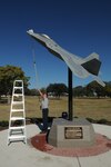Neil Orlowski, 12th Flying Training Wing Maintenance Directorate, cleans an F-22A Raptor display at Airmen's Heritage Park Saturday. As the wing Operational Readiness Inspection draws near, base personnel are preparing to show inspectors the outstanding quality of work from the 12th Flying Training Wing. (U.S. Air Force photo by Rich McFadden)