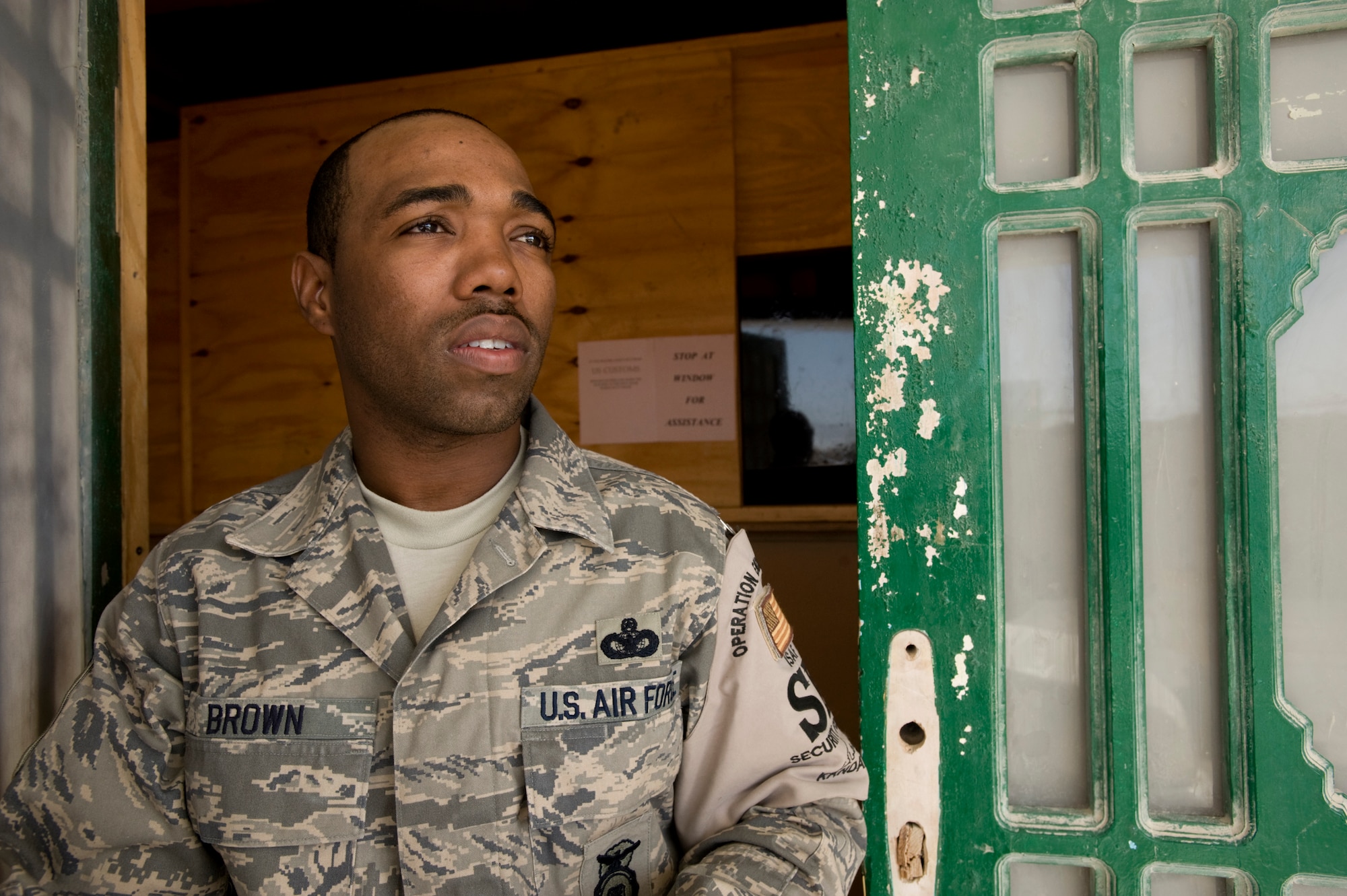 KANDAHAR AIR FIELD, Afghanistan -- Master Sgt. Samel Brown watches as one of his patrols departs the 755th Expeditionary Security Forces Squadron Law and Order station. Sergeant Brown is the noncommisioned officer in charge of the security force Airmen in charge of keeping peace on the NATO base. Sergeant Brown is deployed to Operation Enduring Freedom from Robins Air Force Base, Ga. (U.S. Air Force photo/Master Sgt. Keith Brown)