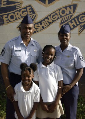 The Toney family consists of Senior Master Sgt. Jason Toney, 36th Force Support Squadron, Tech. Sgt. Travana Toney, 36th Wing, 8-year-oldBrianna Toney and 5-year-old Jordan Toney. The Toney family makes volunteering a joint effort, with new ideas coming from all members of the family. The Toney family most recently volunteered painting local George Washington High School. (U.S. Air Force photo by Airman 1st Class Carissa Wolff)                    