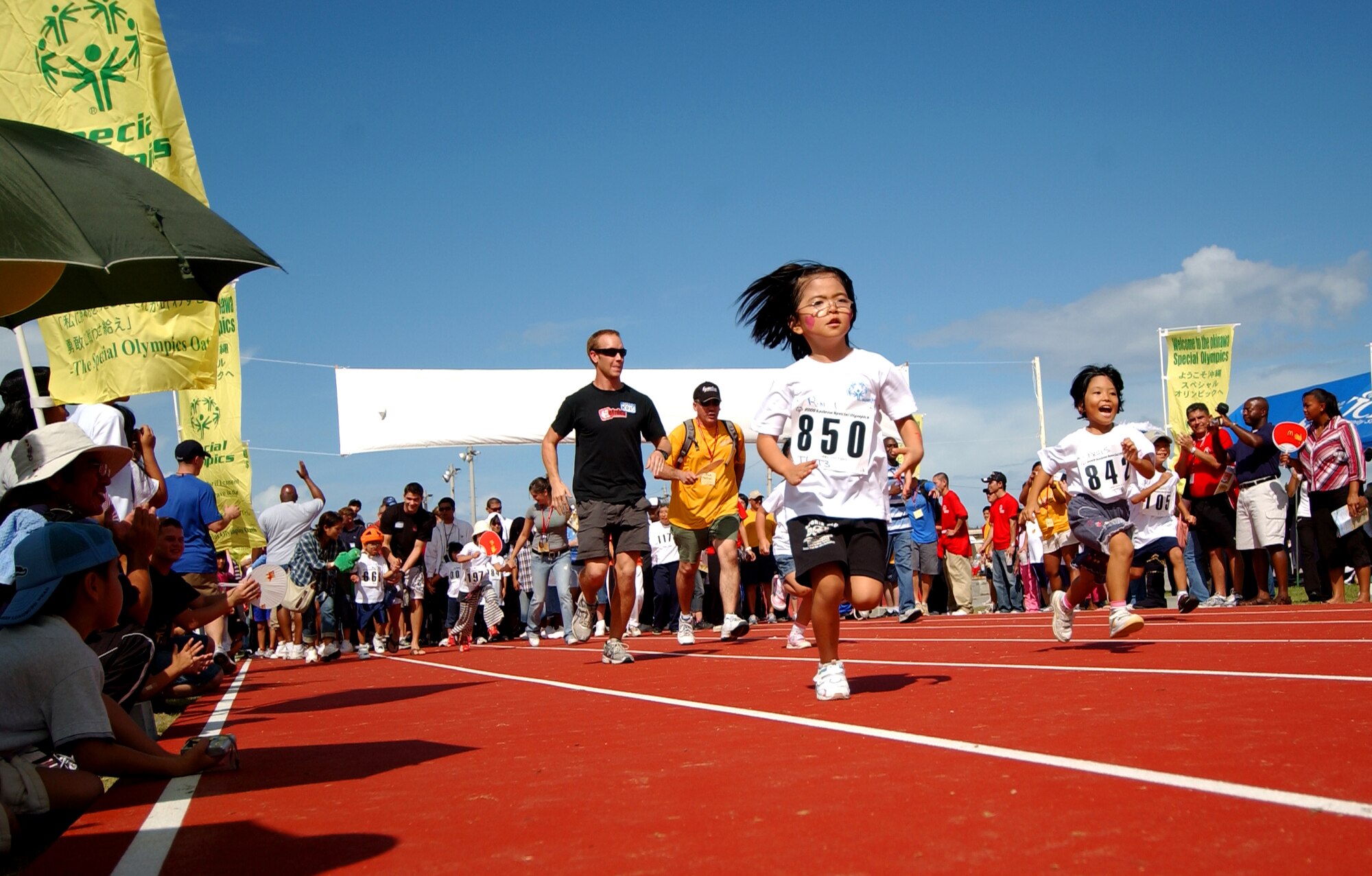 A young Okinawan girl participates in a run during the beginning of Kadena Special Olympics Nov. 8, 2008 at Kadena Air Base, Japan.  Kadena hosted the 9th Annual Special Olympic Games and Art Festival for special needs Okinawan and American adult and child athletes.    (U.S. Air Force photo/Tech. Sgt. Rey Ramon)                        