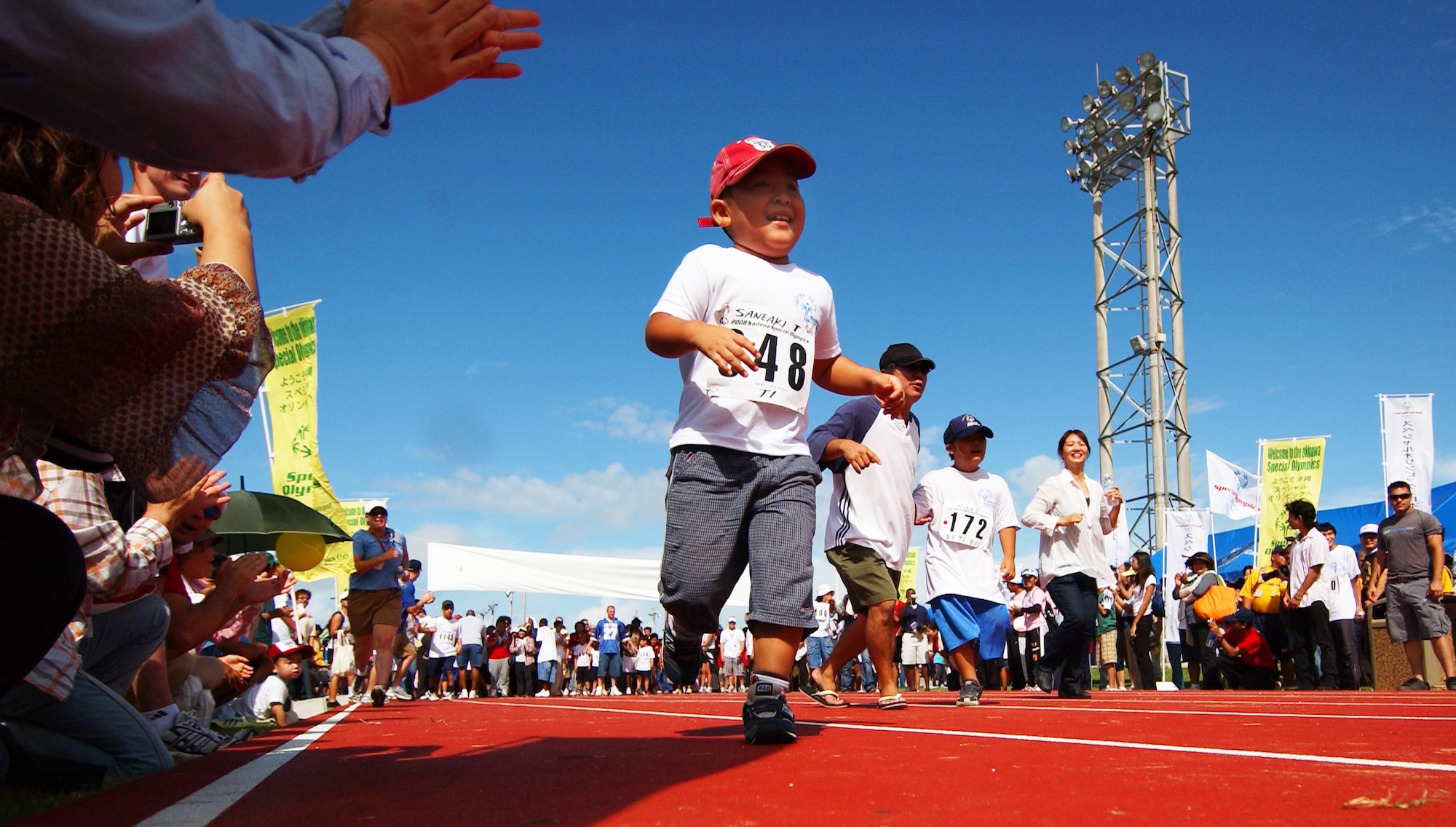 A young Okinawan boy participates in a run during the beginning of Kadena Special Olympics Nov. 8, 2008 at Kadena Air Base, Japan. Kadena hosted the 9th Annual Special Olympic Games and Art Festival for special needs Okinawan and American adult and child athletes.    (U.S. Air Force photo/Tech. Sgt. Rey Ramon)                           