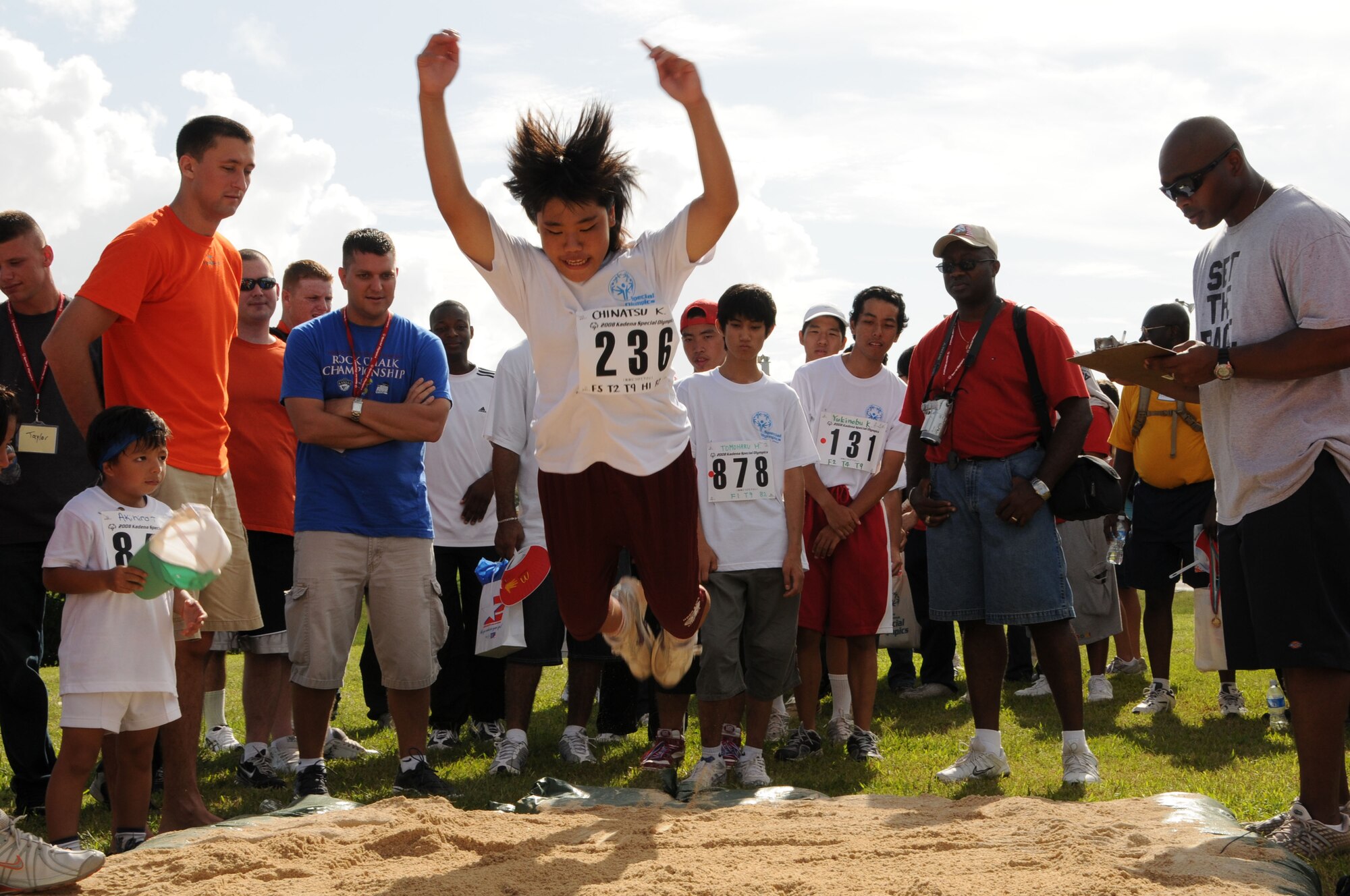 Chinatsu-san, a Special Olympic participant, jumps as far as she can during the standing long jump contest Nov. 8, 2008 at Kadena Air Base, Japan. Kadena hosted the 9th Annual Special Olympic Games and Art Festival for special needs Okinawan and American athletes. (U.S. Air Force photo/Staff Sgt. Chrissy Best)  
                                             