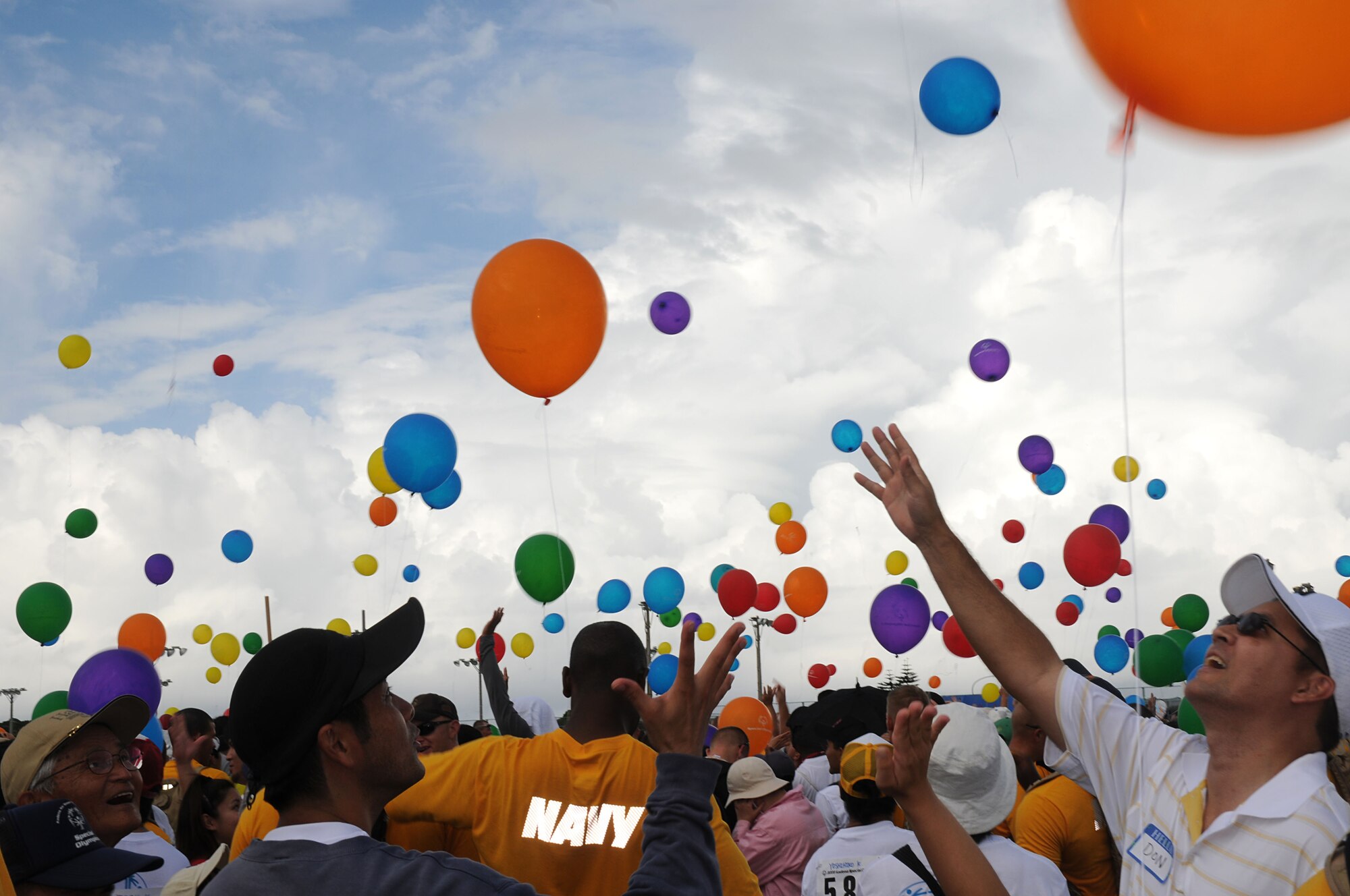 Military volunteers and participants release over a 1,000 balloons into the sky signaling the start of the 9th Annual Kadena Special Olympics Nov. 8, 2008, Kadena Air Base, Japan. Kadena hosted the games and Art Festival for special needs Okinawan and American adult and child athletes.   (U.S. Air Force photo/Staff Sgt. Chrissy Best)
                                             
