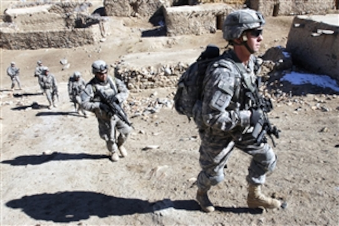 U.S. Army soldiers patrol a small village during an air assault mission in Bamyan province, eastern Afghanistan, Nov. 4, 2008. The soldiers are assigned to Alpha Company, 101st Division Special Troops Battalion, 101st Airborne Division.