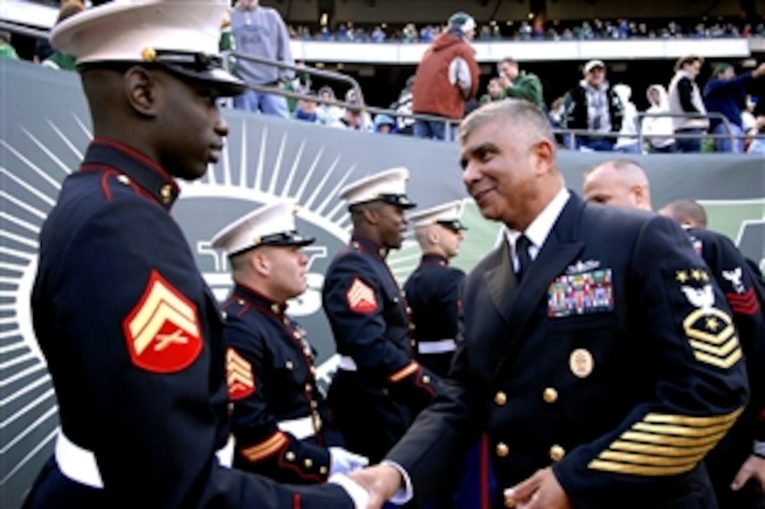 Master Chief Petty Officer of the Navy  Joe R. Campa Jr. talks with Marines along the sidelines at the Meadowlands during halftime of the New York Jets and St. Louis Rams game on Military Appreciation Day, East Rutherford, N.J., Nov. 9, 2008.