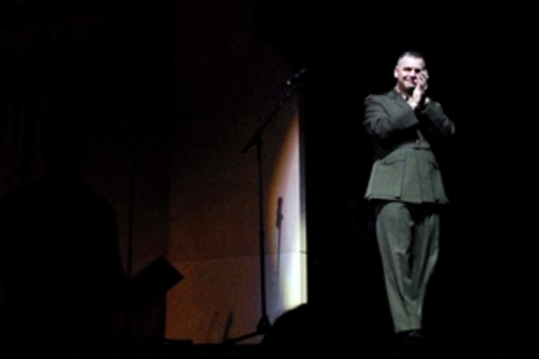 Marine Gen. James E. Cartwright, vice chairman of the Joint Chiefs of Staff, applauds the 25 wounded warriors in the audience at New York's Radio City Music Hall on Nov. 8, 2008. The 25 warriors were joined by nearly 5,000 other servicemembers and their families for a special preview of the theater’s "Christmas Spectacular," featuring the Rockettes. The special preview of the show was open to servicemembers and their families courtesy of Microsoft. 