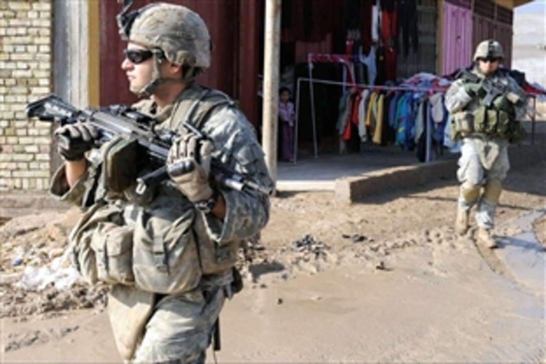 U.S. Army soldiers perform a presence patrol through the streets of Hamadia, in the city of Baghdad, Iraq, Nov. 2, 2008. The soldiers are assigned to the 2nd Squad, 3rd platoon, Charlie Company, 2nd Brigade Combat Team, 1st Armored Division.
