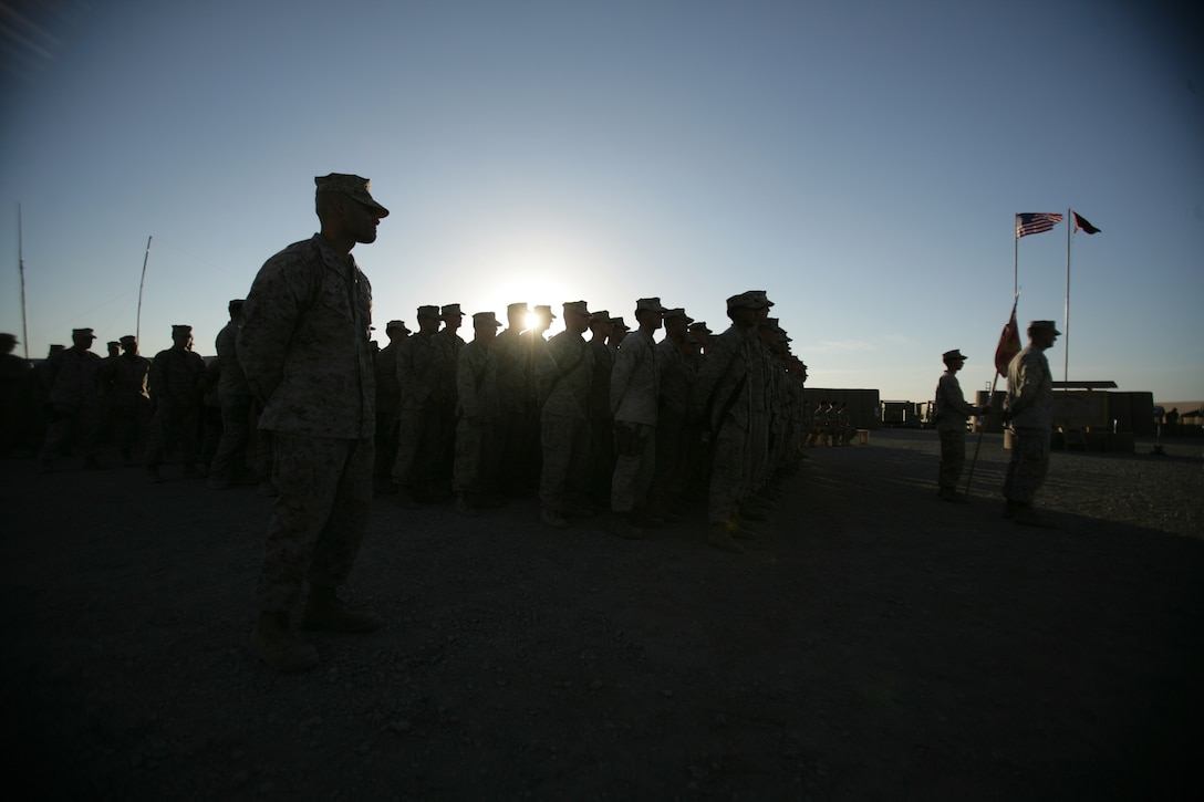 Marines and sailors of Task Force 2/7, Special Purpose Marine Air Ground Task Force Afghanistan, stand in a ceremonial formation along with the Marines and sailors of 3rd Battalion, 8th Marine Regiment, 2d Marine Division, to recognize the Marine Corps' 233rd birthday aboard Camp Barber in the Helmand Province of Afghanistan, Nov. 10.