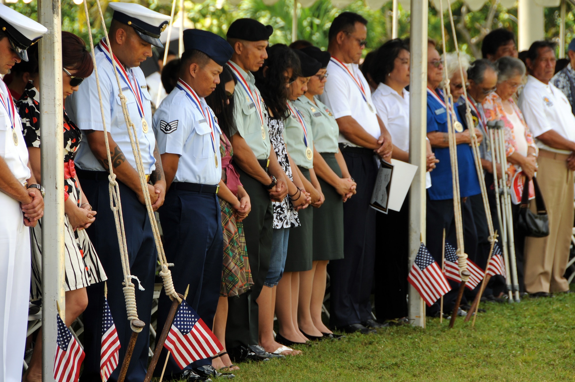 ANDERSEN AIR FORCE BASE, Guam - The crowd observes a moment of silence to remember those who have fallen in the line of duty during the the Veterans Day Ceremony at the Ricardo J. Bordallo Governors Complex in Adelup, Guam Nov. 11. Admiral French reminded us never forget those who gave us our nation, those who defended it and those who preserve it. Let not their uncommon valor be commonly forgotten. (U.S. Air Force photo by Airman 1st Class Courtney Witt)
