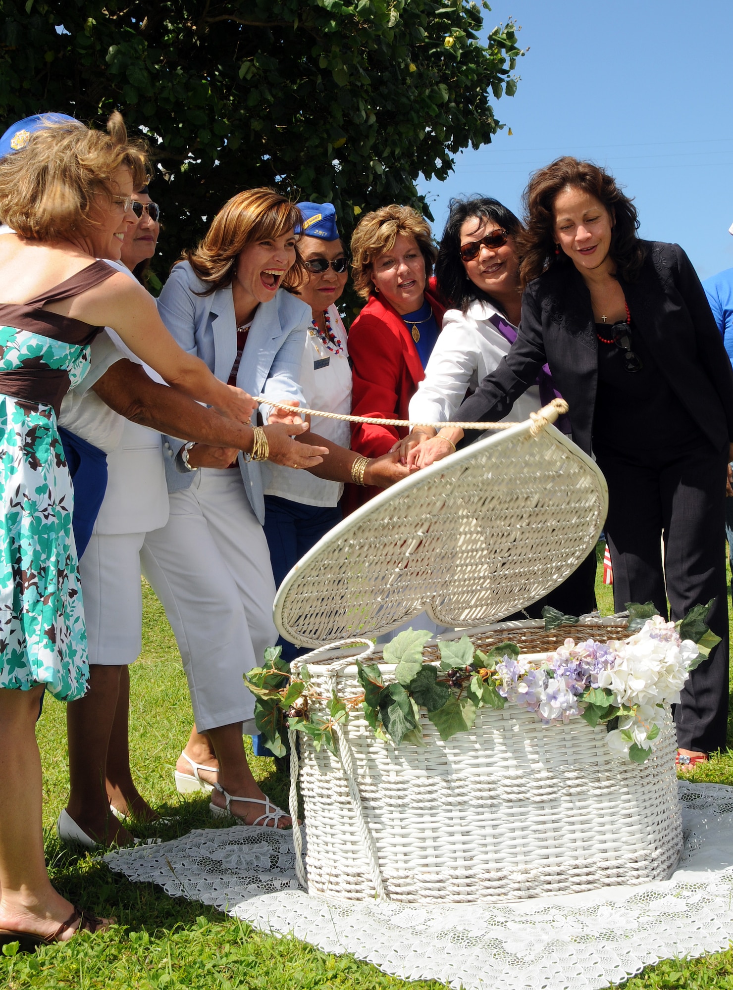 ANDERSEN AIR FORCE BASE, Guam - Mrs. Lina Ruhlman, center, along with other distinguished guests helps release the Freedom Birds during the the Veterans Day Ceremony at the Ricardo J. Bordallo Governors Complex in Adelup, Guam Nov. 11. More than a dozen doves were released symbolizing freedom and faith to all. (U.S. Air Force photo by Airman 1st Class Courtney Witt)