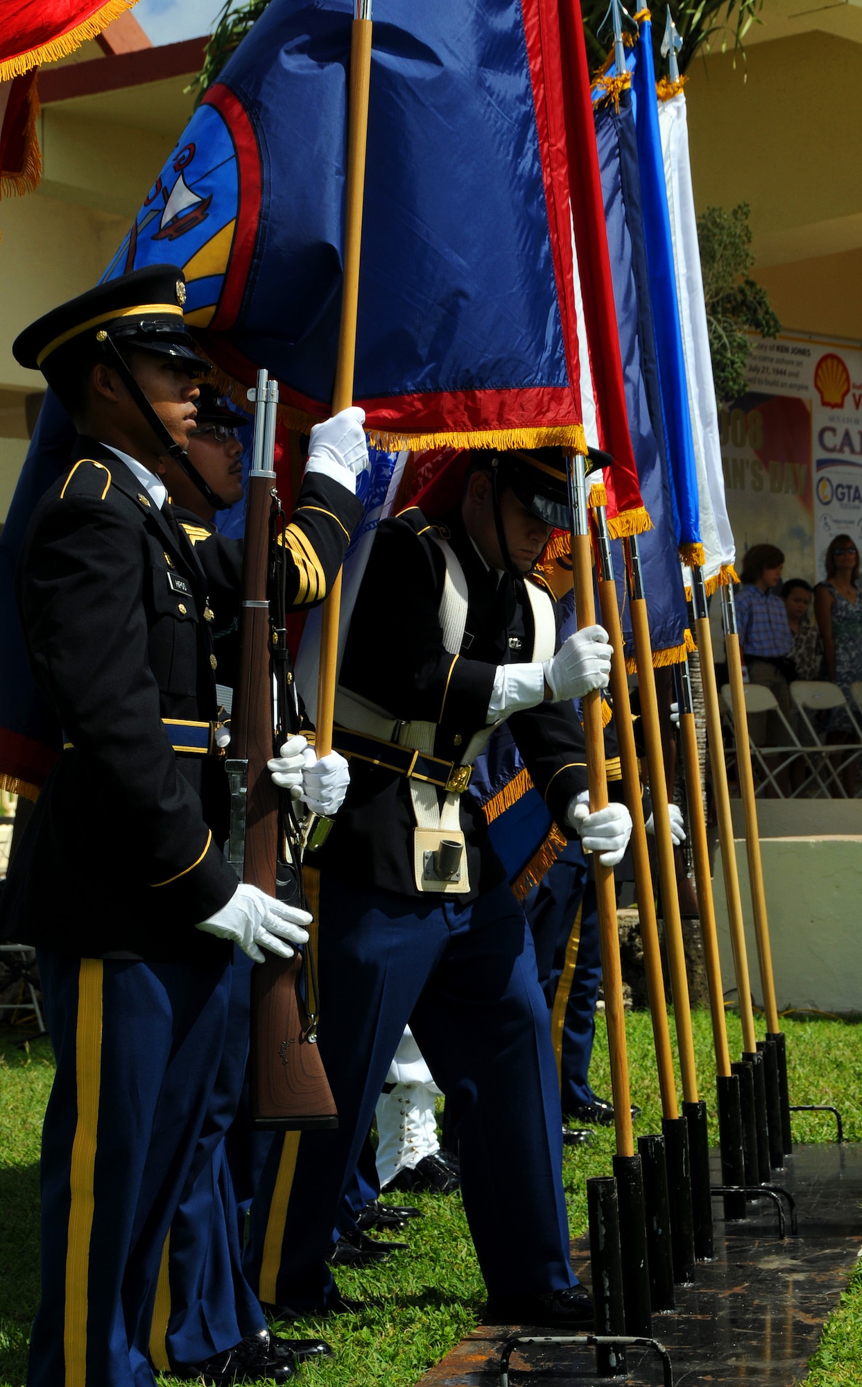 ANDERSEN AIR FORCE BASE, Guam - Joint Honor Guardsmen post the colors during the Veterans Day Ceremony at the Ricardo J. Bordallo Governors Complex in Adelup, Guam Nov. 11. Americans can reflect on the foresight, courage and sacrifices of past leaders and heroes and remember the courage and sacrifices of today's Soldiers, Sailors, Marines, Airmen, and Coast Guardsmen, who are fighting for freedom and providing humanitarian relief at home and overseas. (U.S. Air Force photo by Airman 1st Class Courtney Witt)