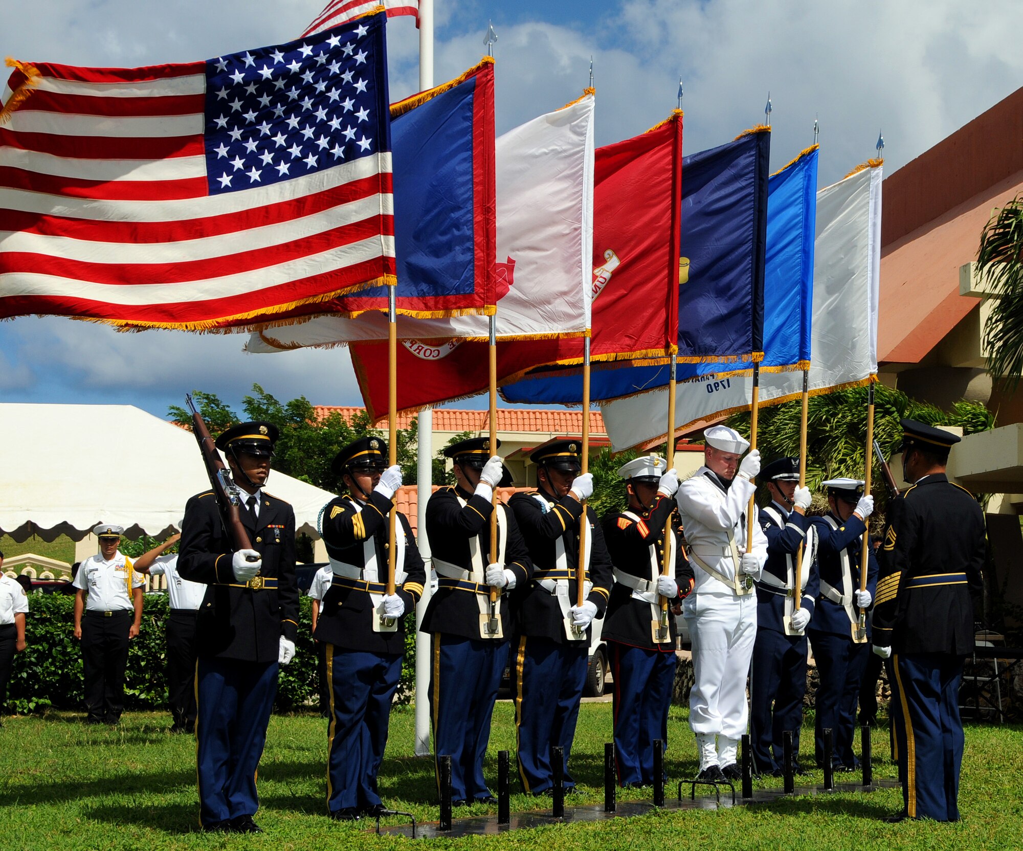 ANDERSEN AIR FORCE BASE, Guam - Joint Honor Guardsmen post the colors during the Veterans Day Ceremony at the Ricardo J. Bordallo Governors Complex in Adelup, Guam Nov. 11. Guam paused to remember those who have given so much in the defense of American freedoms and ideals. (U.S. Air Force photo by Airman 1st Class Courtney Witt)