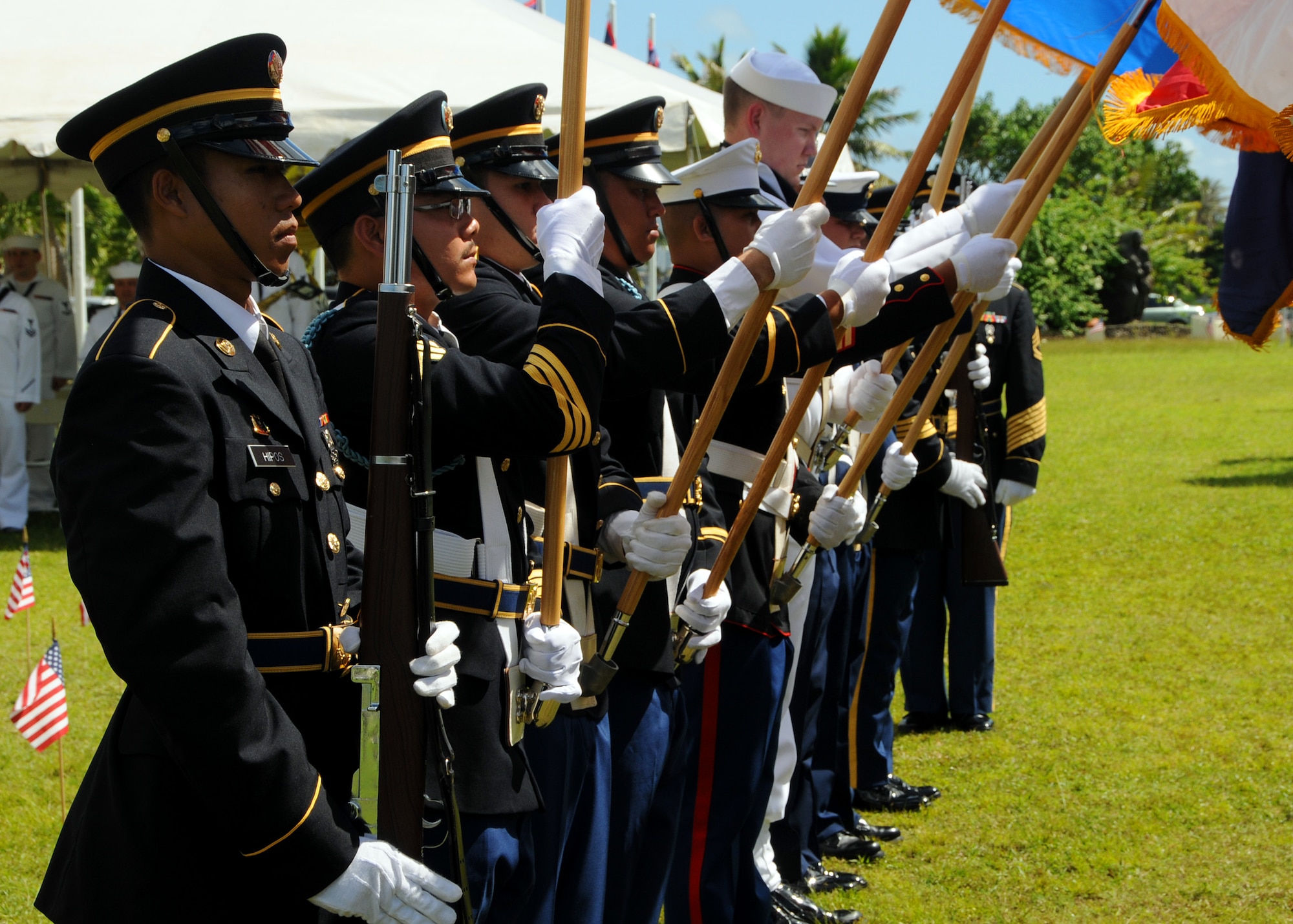ANDERSEN AIR FORCE BASE, Guam - Joint Honor Guardsmen post the colors during the Veterans Day ceremony at the Ricardo J. Bordallo Governors Complex in Adelup, Guam Nov. 11. Guam paused to remember those who have given so much in the defense of American freedoms and ideals. (U.S. Air Force photo by Airman 1st Class Courtney Witt)