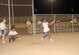 SOUTHWEST ASIA -- Jason Session hits a line drive down third-base line in a softball tournament here Nov. 8. The Civil Engineers defeated the Office of Special Investigations conglomerate, 18-12, during the championship game in the 380th Air Expeditionary Wing Combined Federal Campaign Softball Tournament. Proceeds were dontated to the USO through the CFC. (U.S. Air Force photo by Tech. Sgt. Denise Johnson)(released)