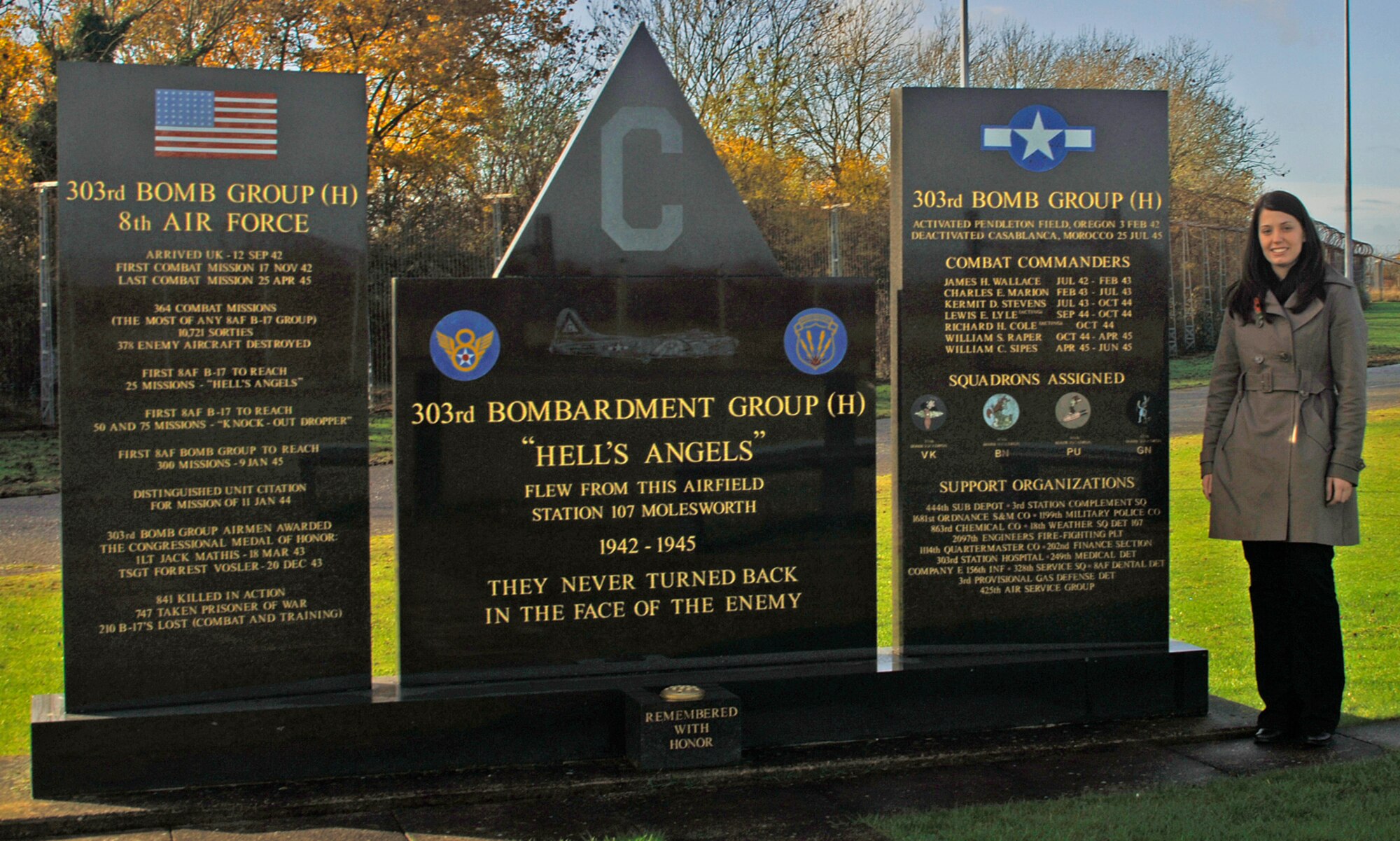 Ms. Kelly Akens stands by the 303rd Bomb Group (Heavy) Memorial at RAF Molesworth, England during her November 7th visit to the base. Ms. Akens, who is the granddaughter of Sergeant Thomas I. Akens who served at Molesworth in 1945 during the Second World War, is the first 303rd Bomb Group grandchild to visit Molesworth on her own. (U.S. Air Force Photo by Ms. Stacey Logan)
